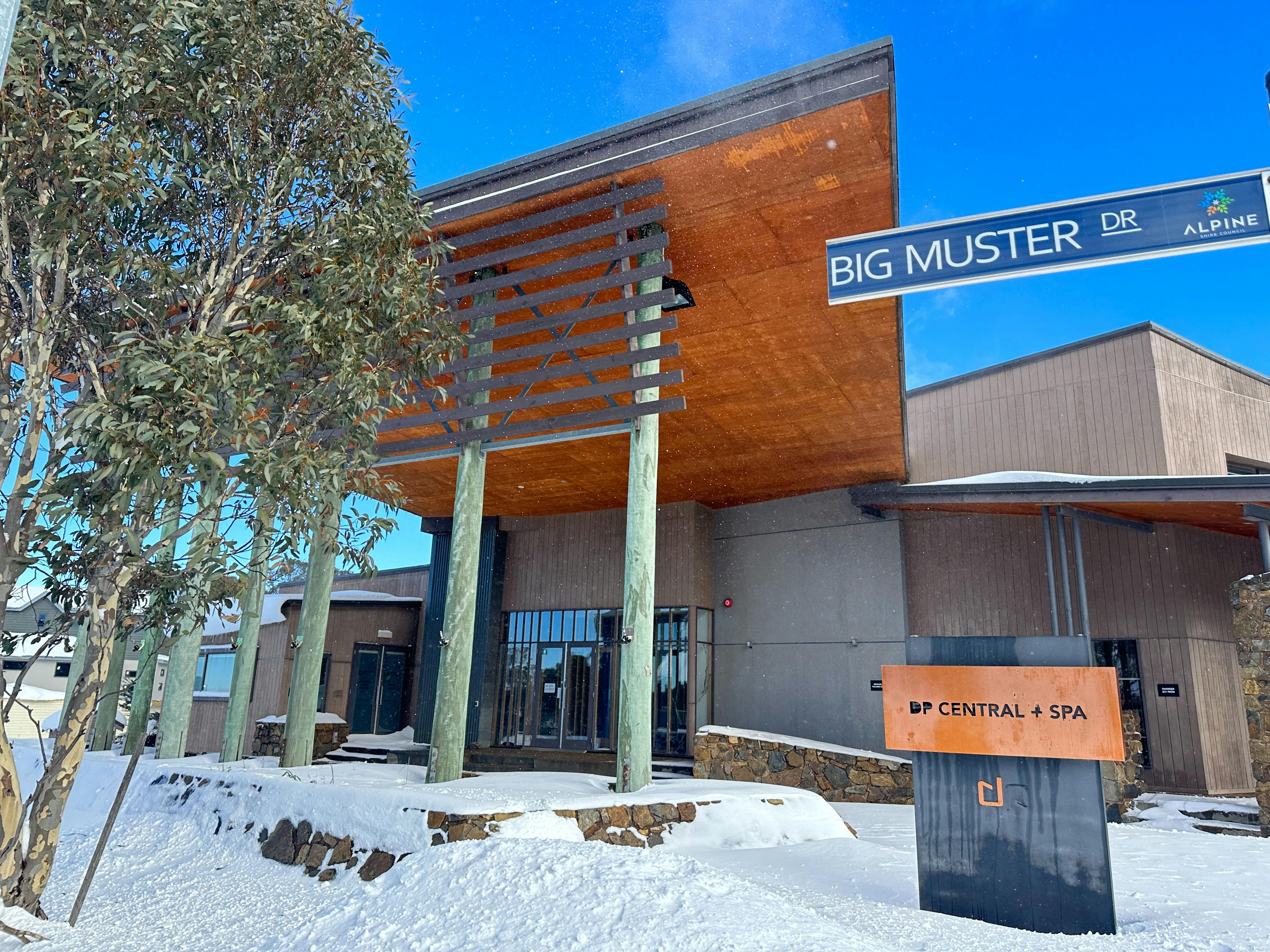 Entrance to the building with snow on the road outside