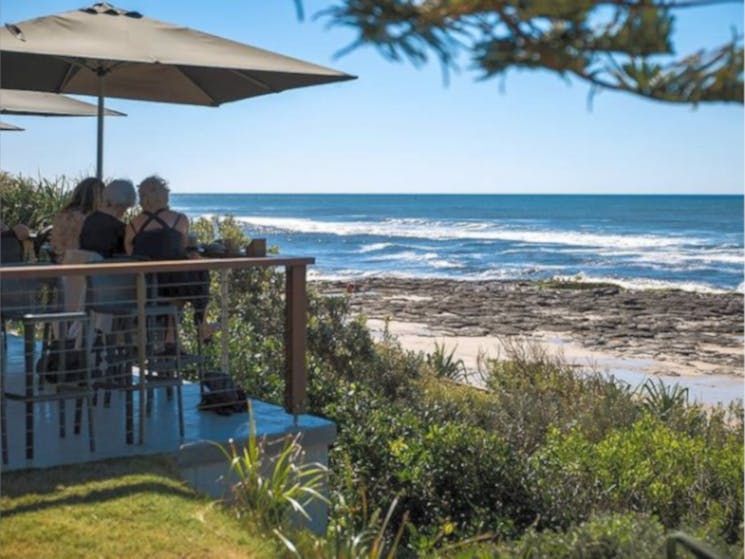 Dining under the trees and overlooking the beach