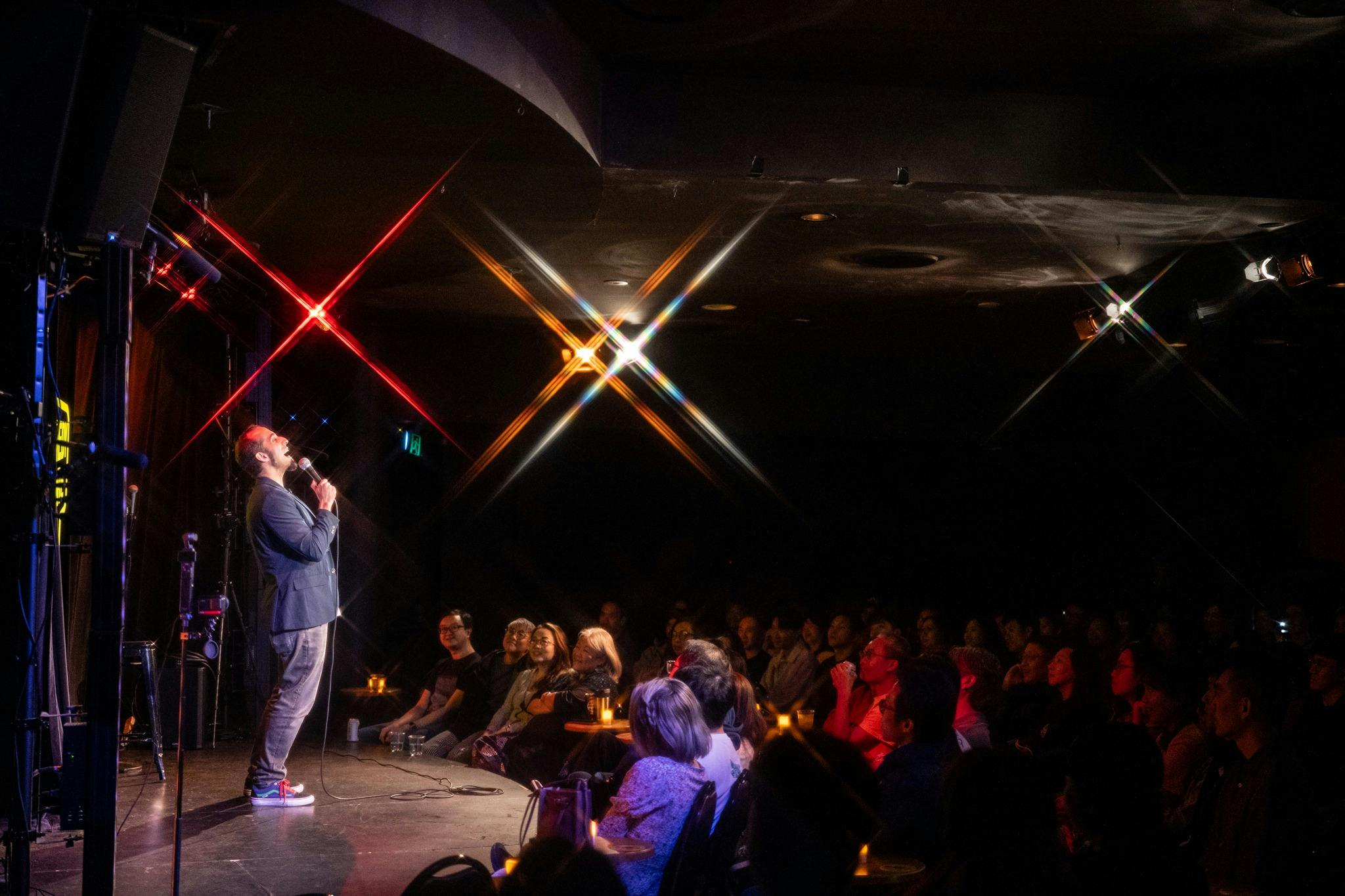 Comedian performing on stage at The Comedy Store Sydney.