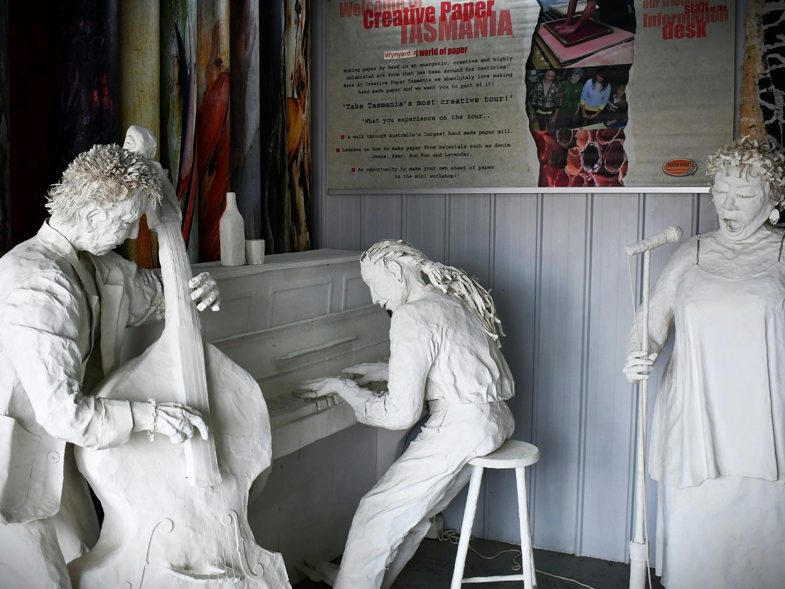 Paper Mache sculpture, little girl feeding ducks.