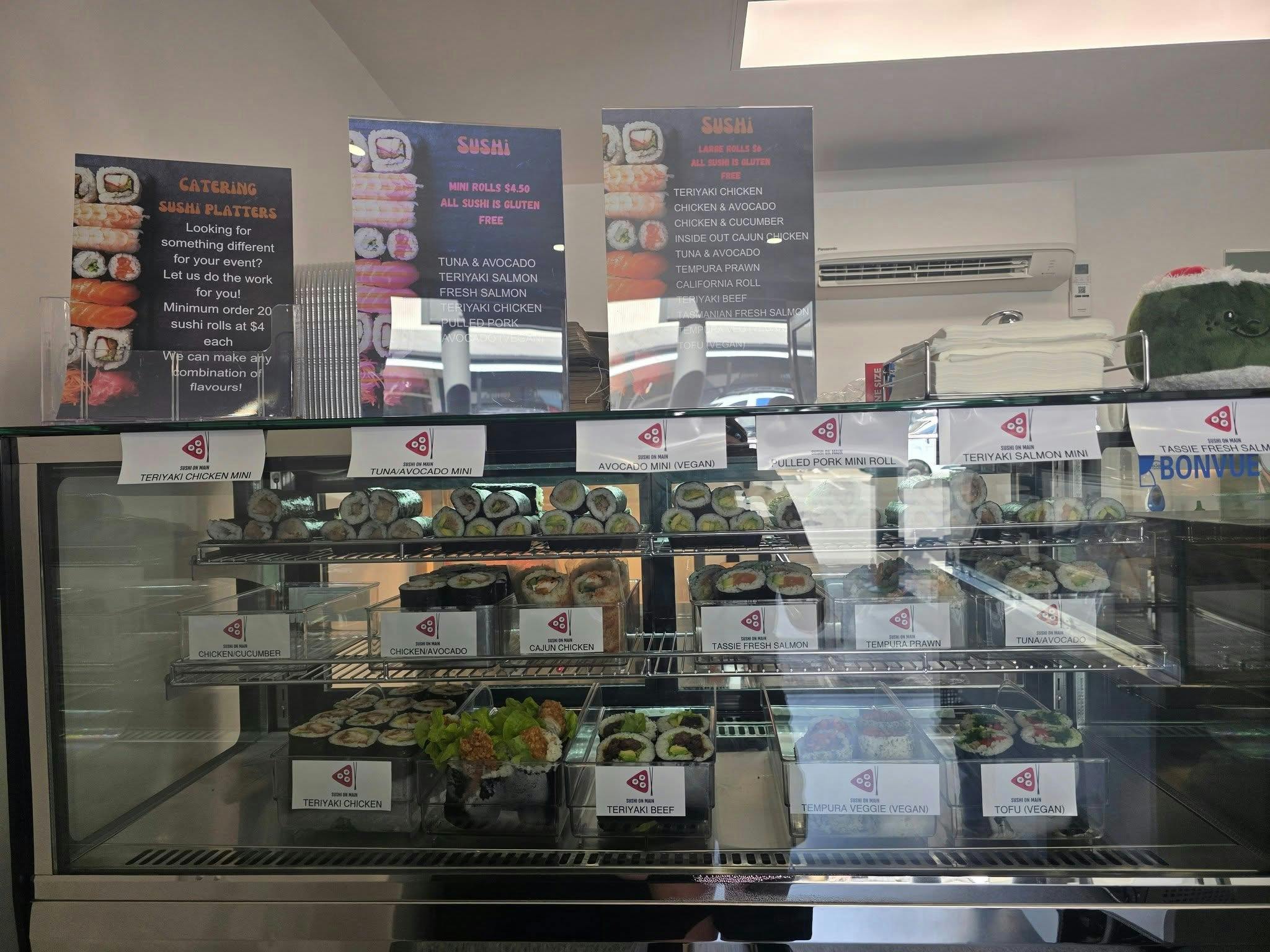 Sushi displayed in a case within the shop