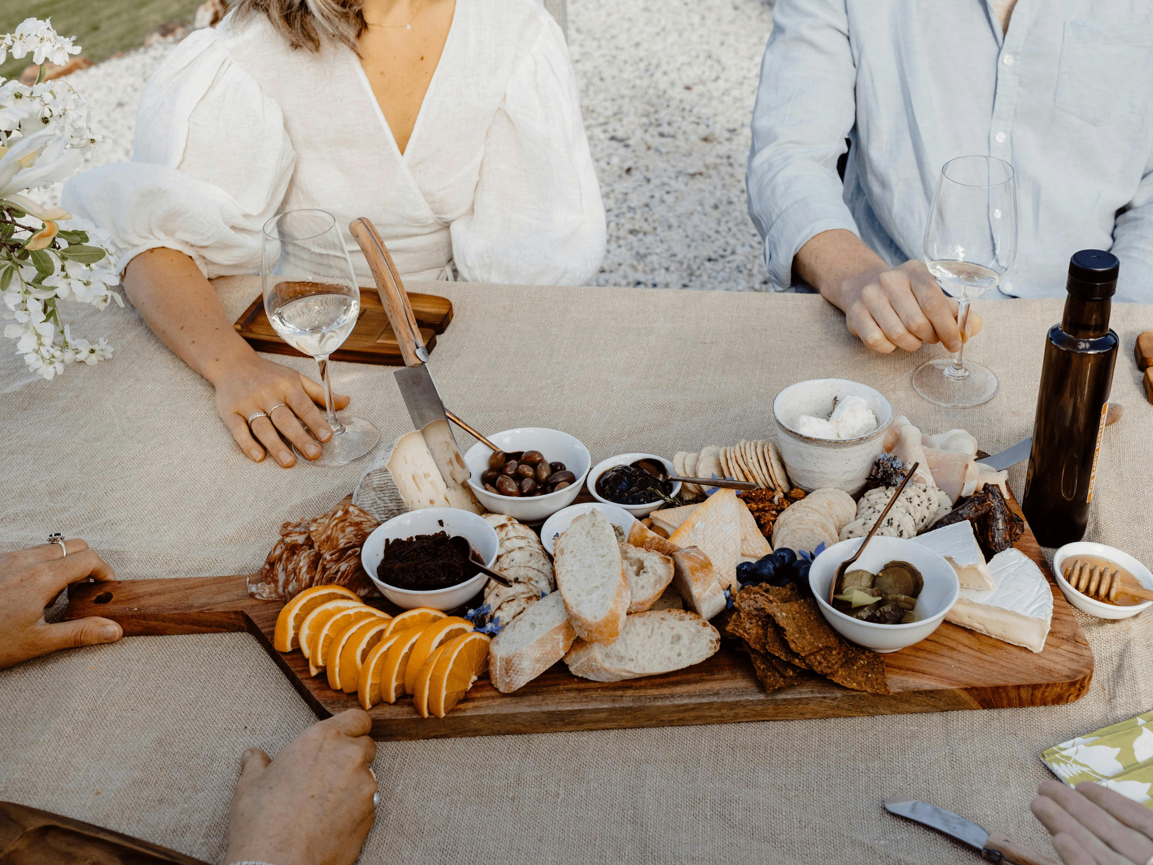 Group of people enjoying a cheese platter during their tasting at macquariedale organic wines