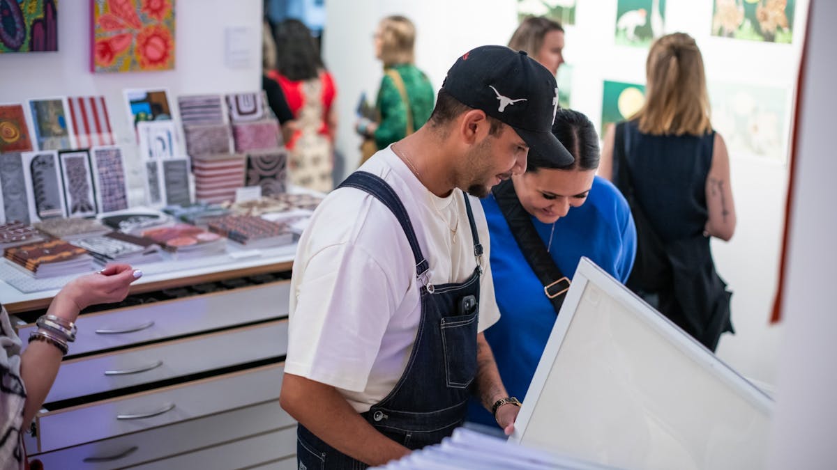 Visitors of NorthSite Store enjoying shopping contemporary art from FNQ