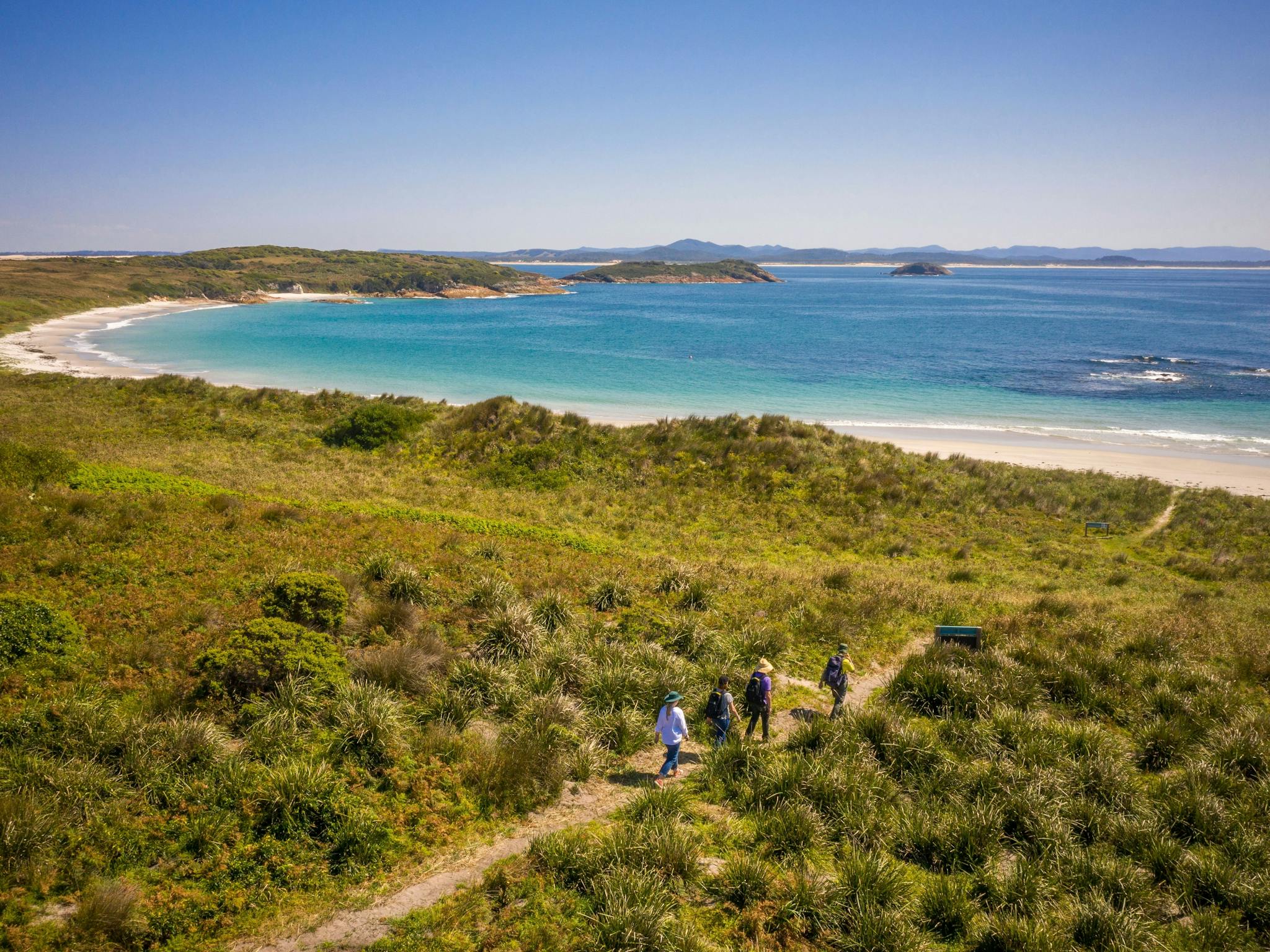 People walking along the walking track, Providence Beach, Broughton Island, Myall Lakes NationalPark
