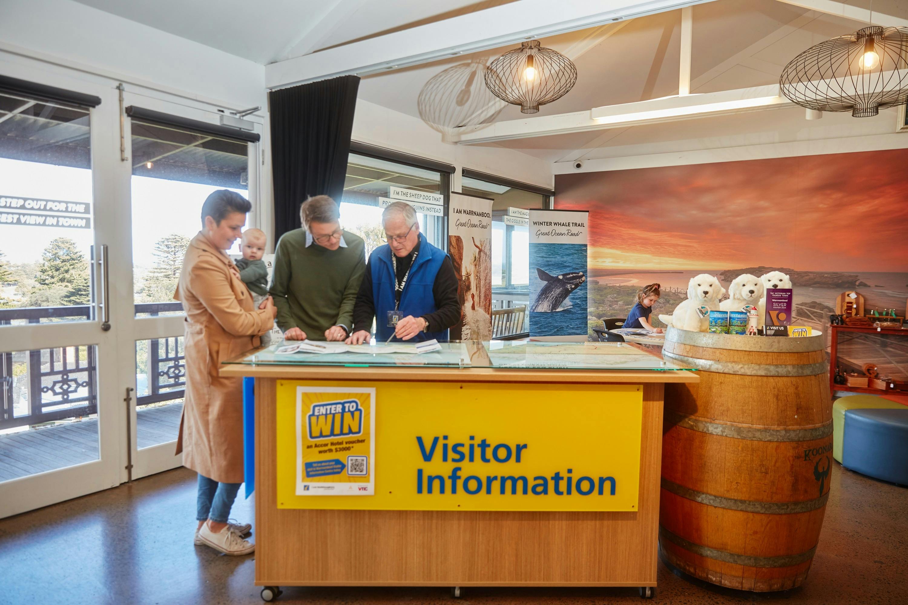 staff member helping a family with information