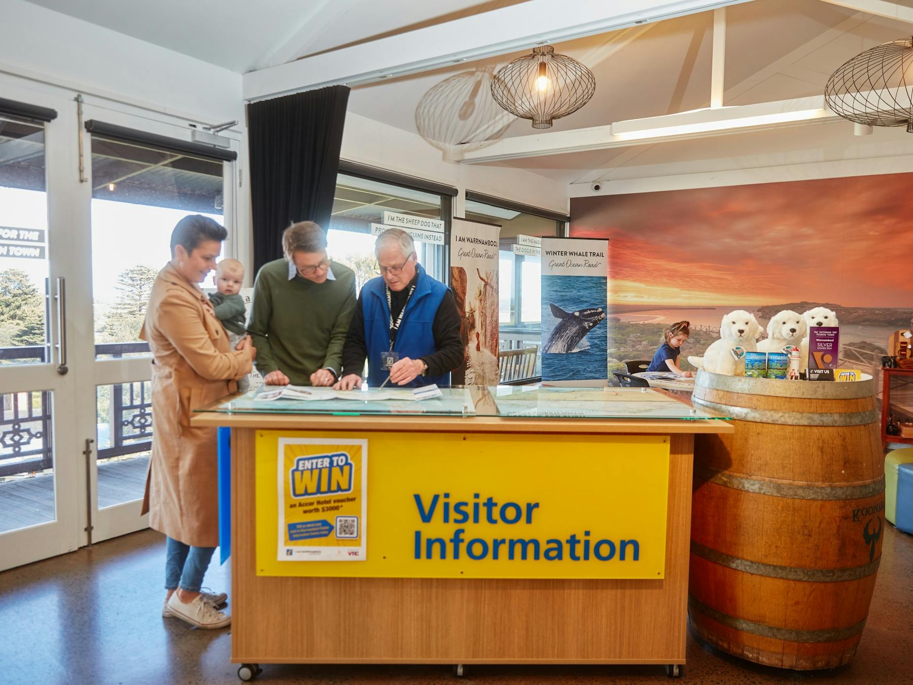 staff member helping a family with information