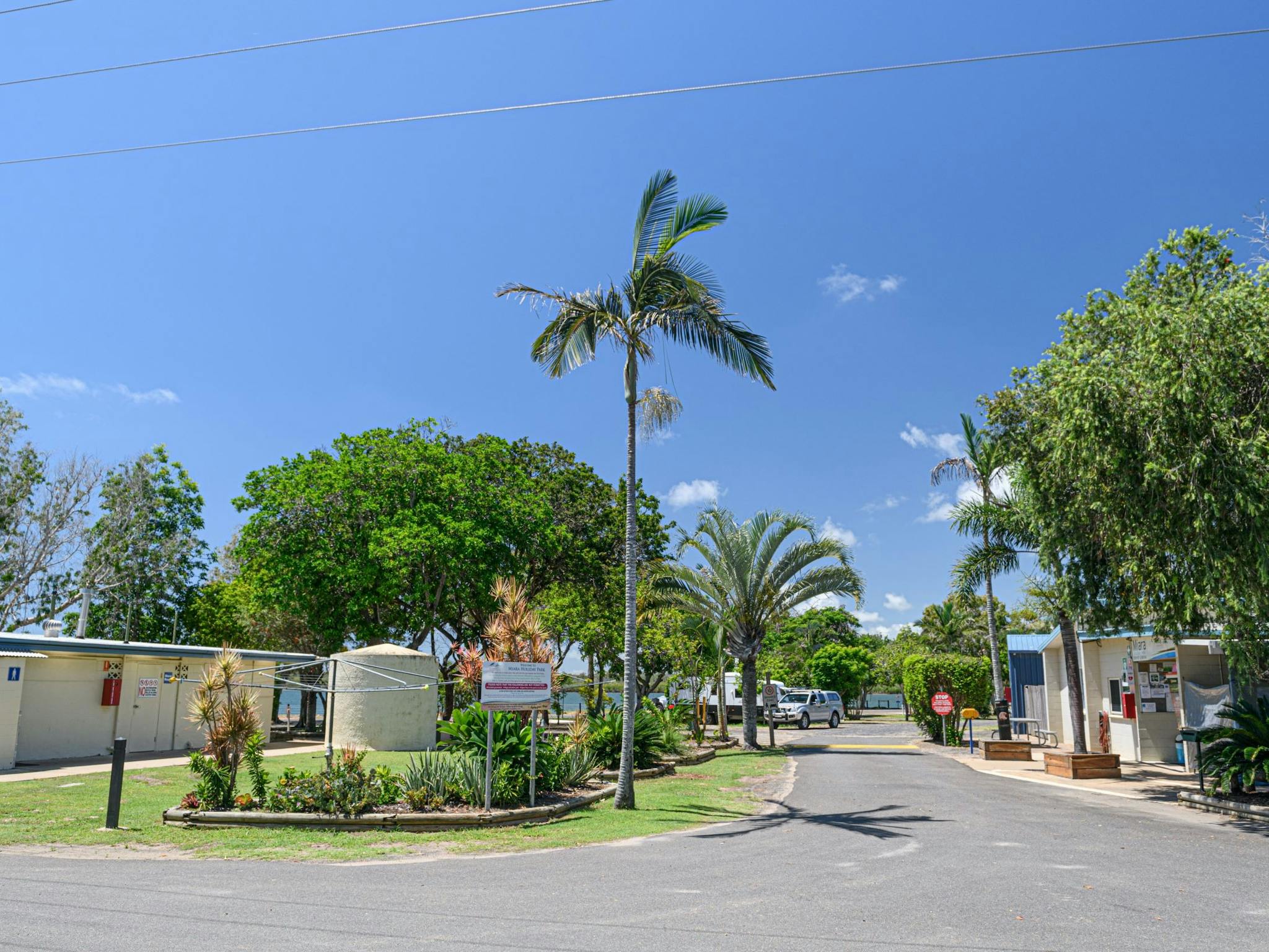 Entrance to Miara Holiday park with the office on the right and amenities on the left. Entrance to Miara Holiday park with the office on the right and amenities on the left.