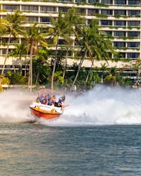 Cairns Jet Boating's Bad Fishy boat creating huge waves as it cuts through the Trinity Inlet