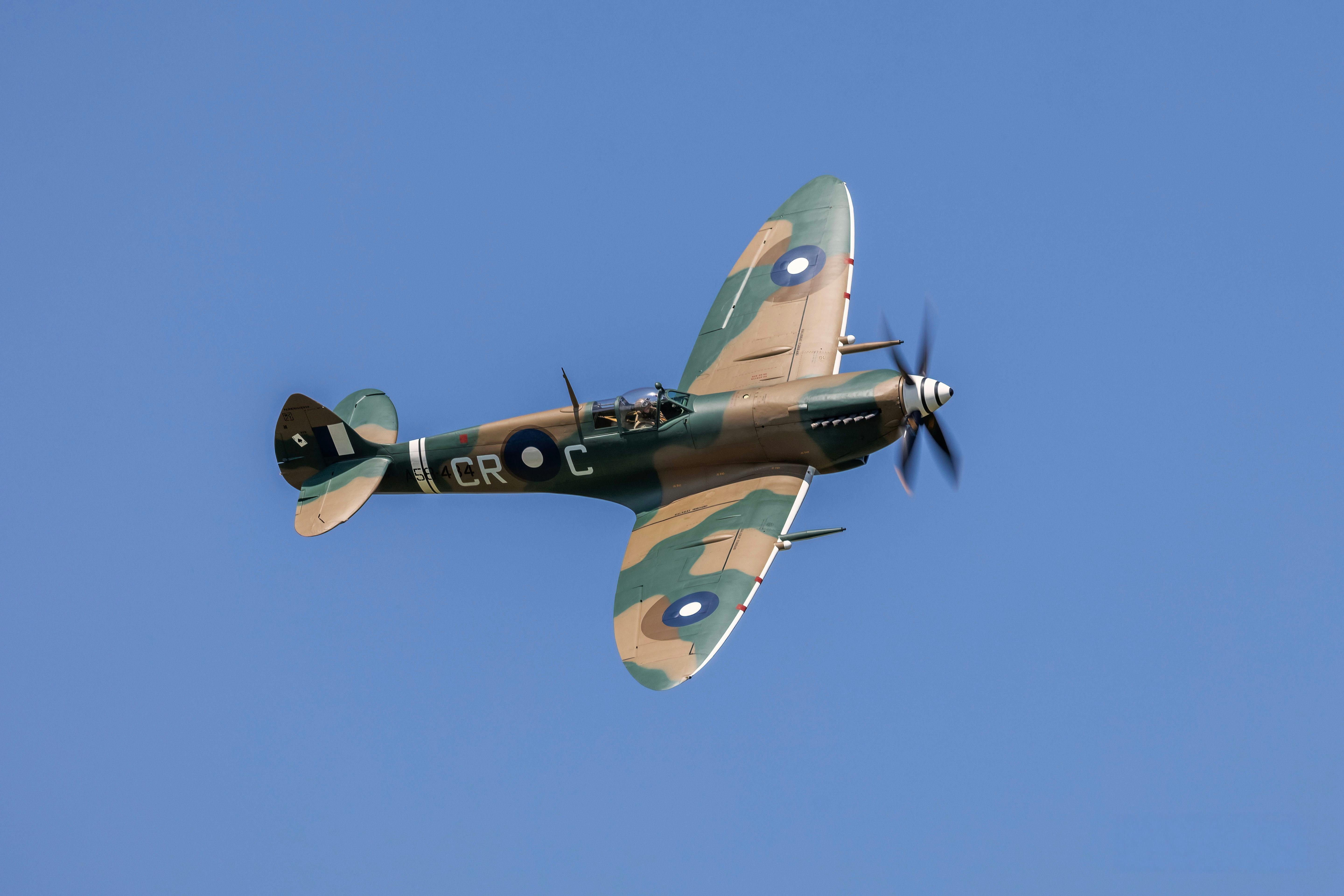 A Supermarine Spitfire in RAAF camouflage livery flying overhead at Barrington Coast Airshow