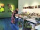 Artist Dore Stockhausen painting in her studio at Mayday Hills, Beechworth