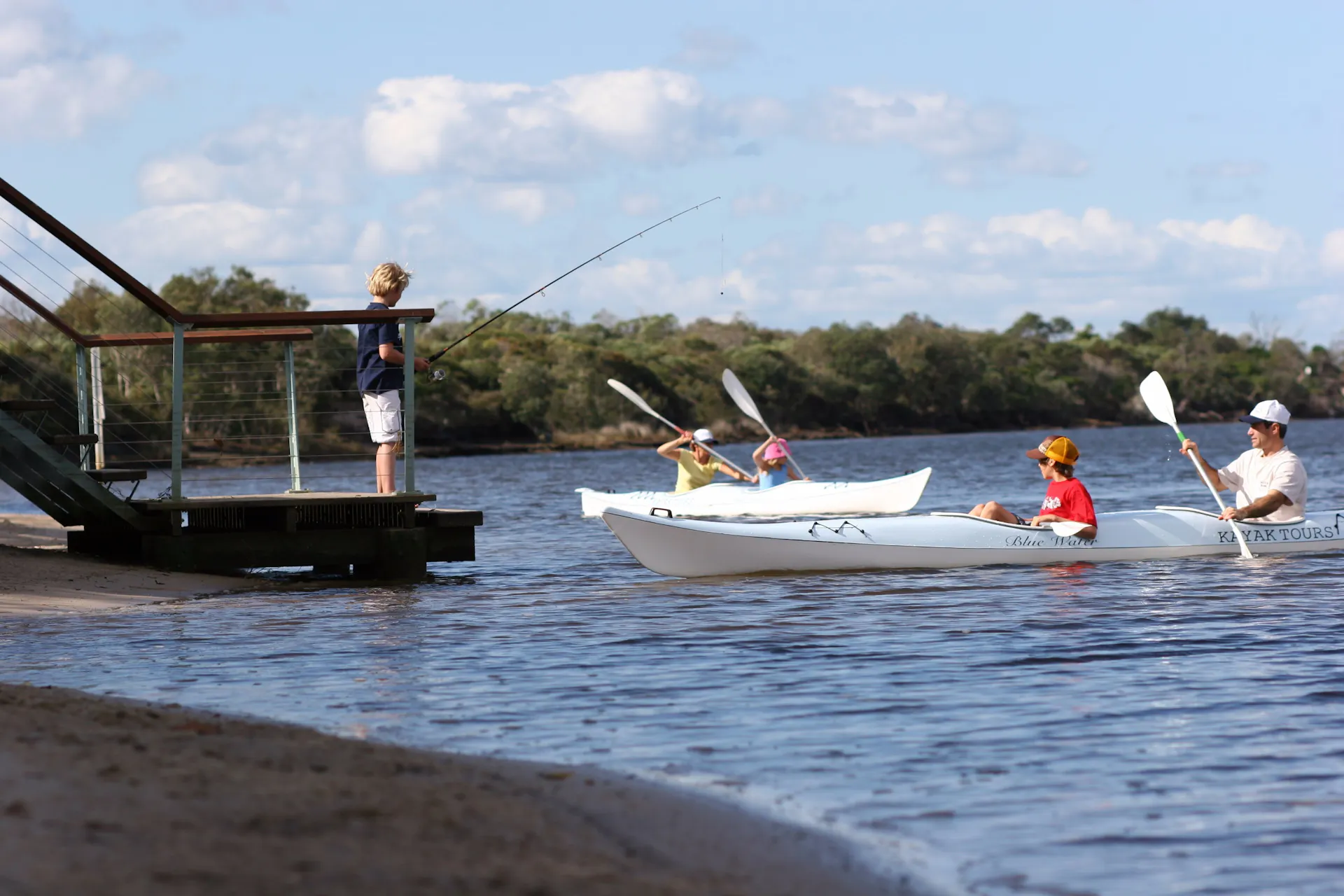 Paddling canoes and kayaks on Currimundi Lake