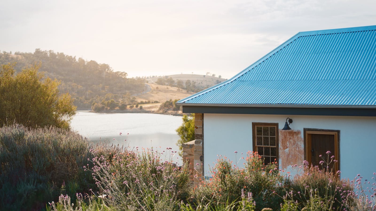 The cottage is surrounded by beauty - pollinating gardens to the front and the river behind