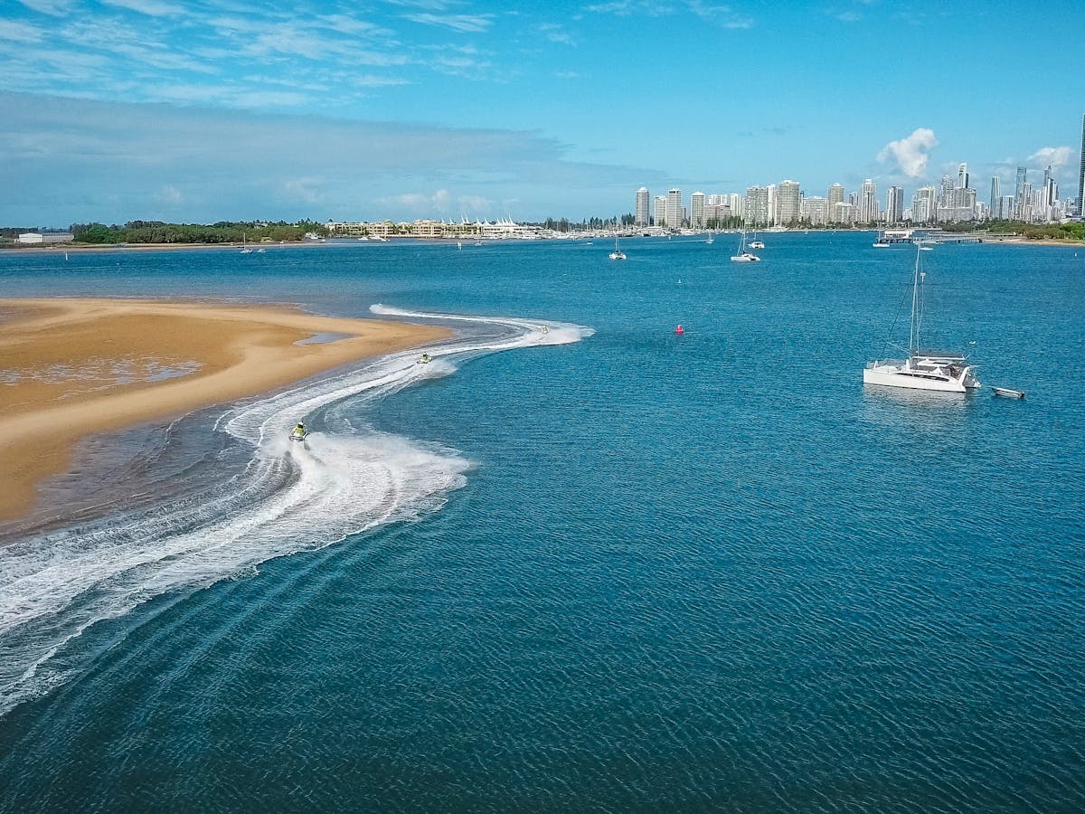 Skis riding around a sandbar on the Gold Coast