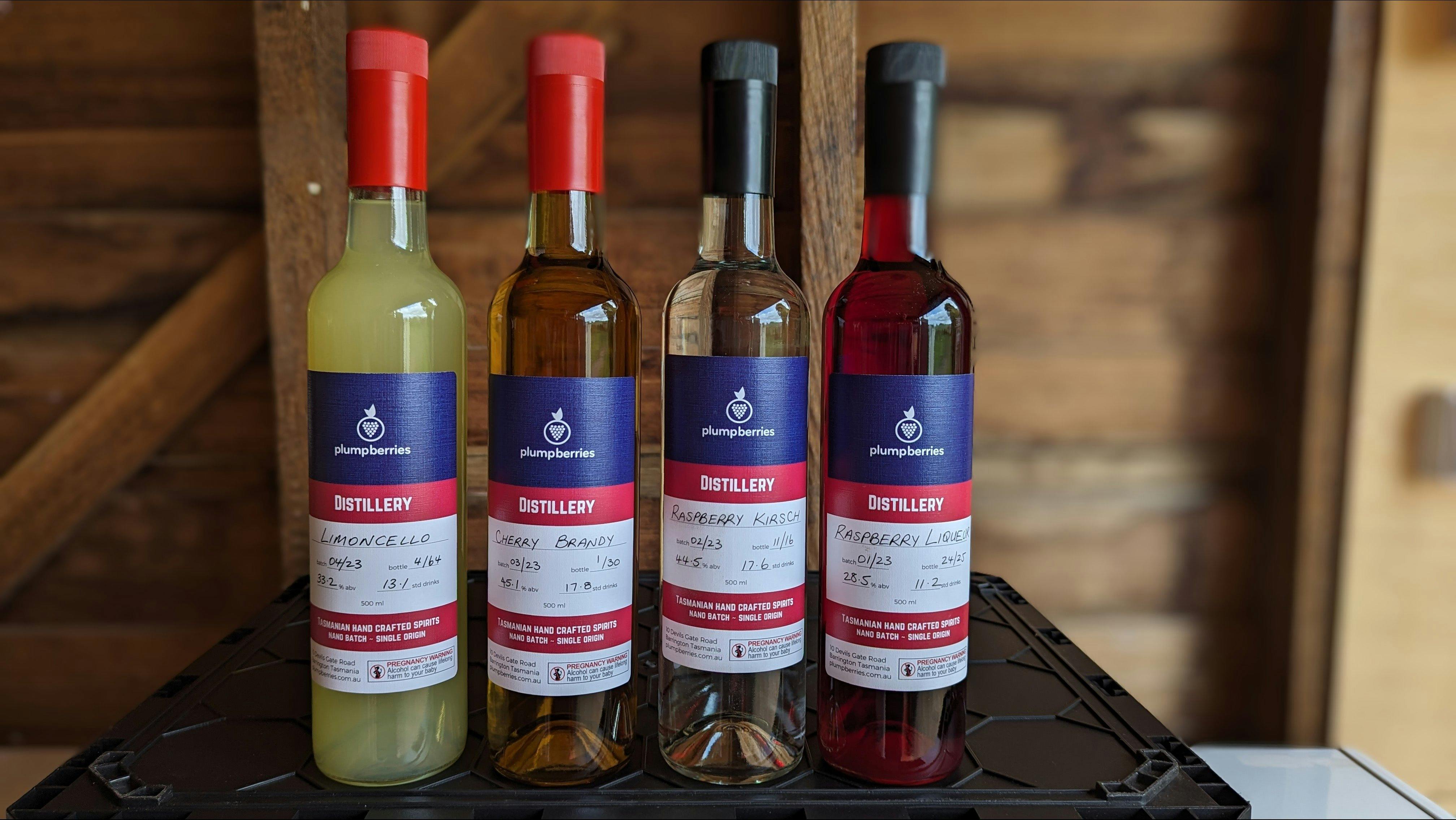 Bottles of Plump Berries limoncello, cherry brandy, raspberry kirsch and raspberry liqueur