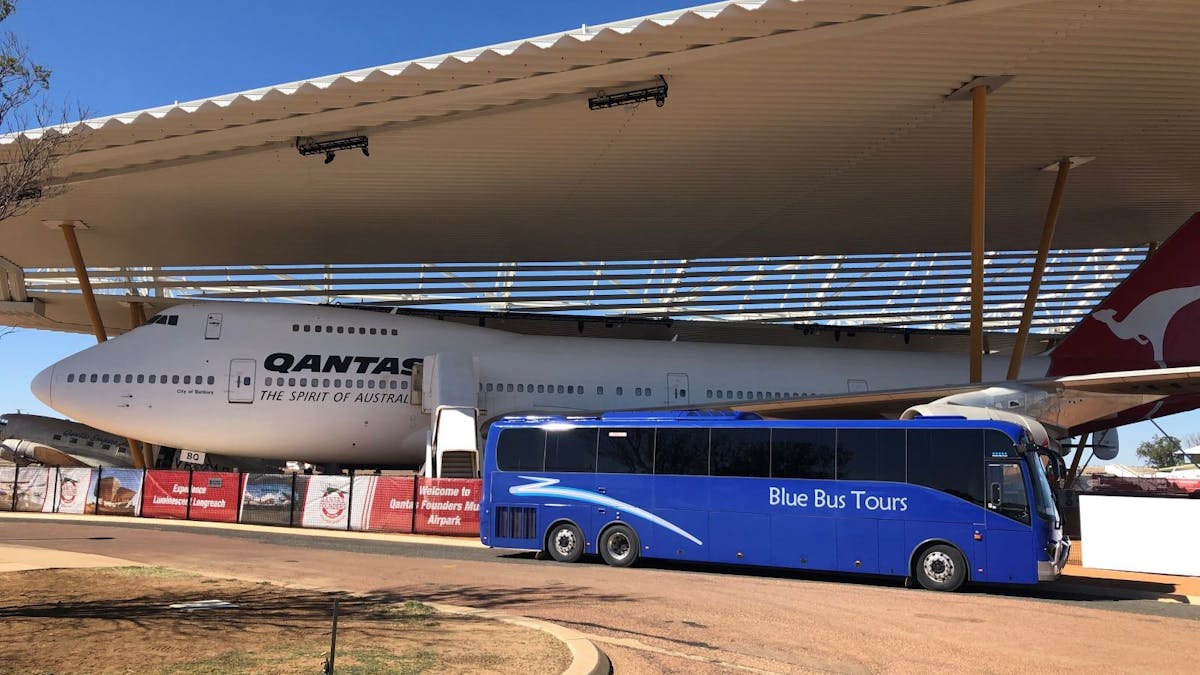 Coach near airplane