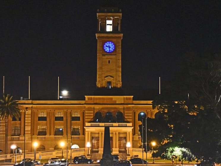 Building with clock tower at night