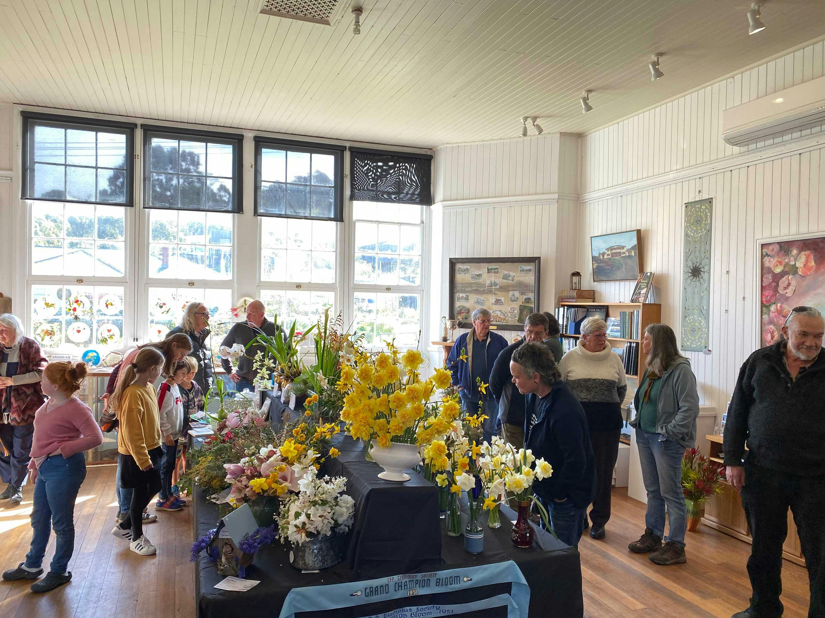 people viewing table arrangements at flower show