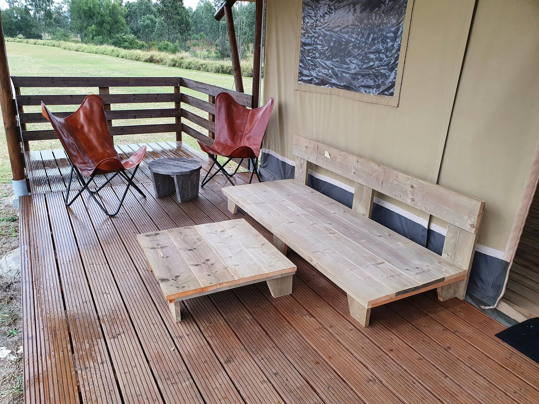 Glamping tents with covered outdoor seating. Glamping tents with covered outdoor seating.