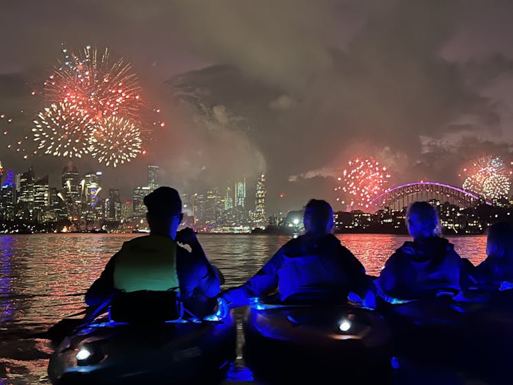 kayakers taking in the breathtaking views of Sydney fireworks