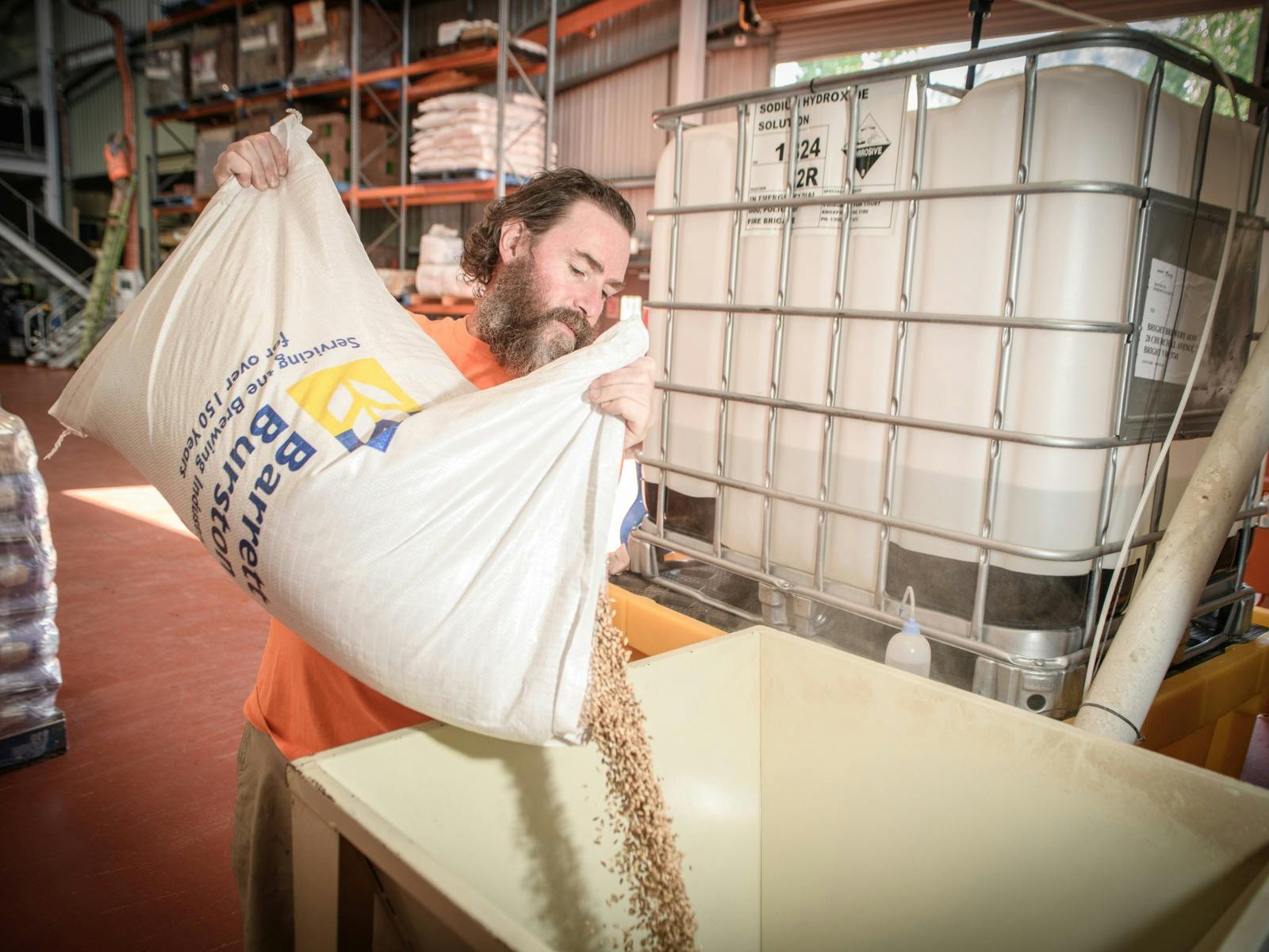 Assistant Brewer David Stokie putting grain into the the mill