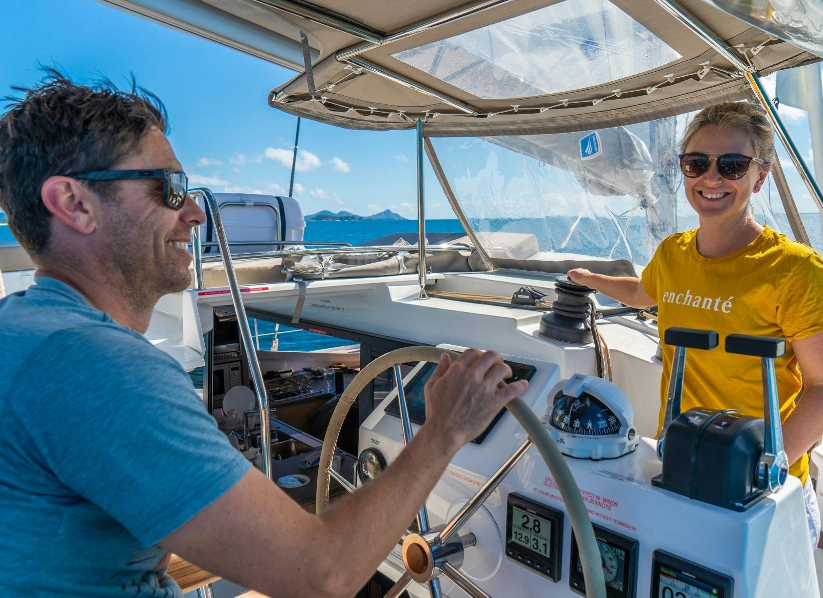 2 people sailing a boat