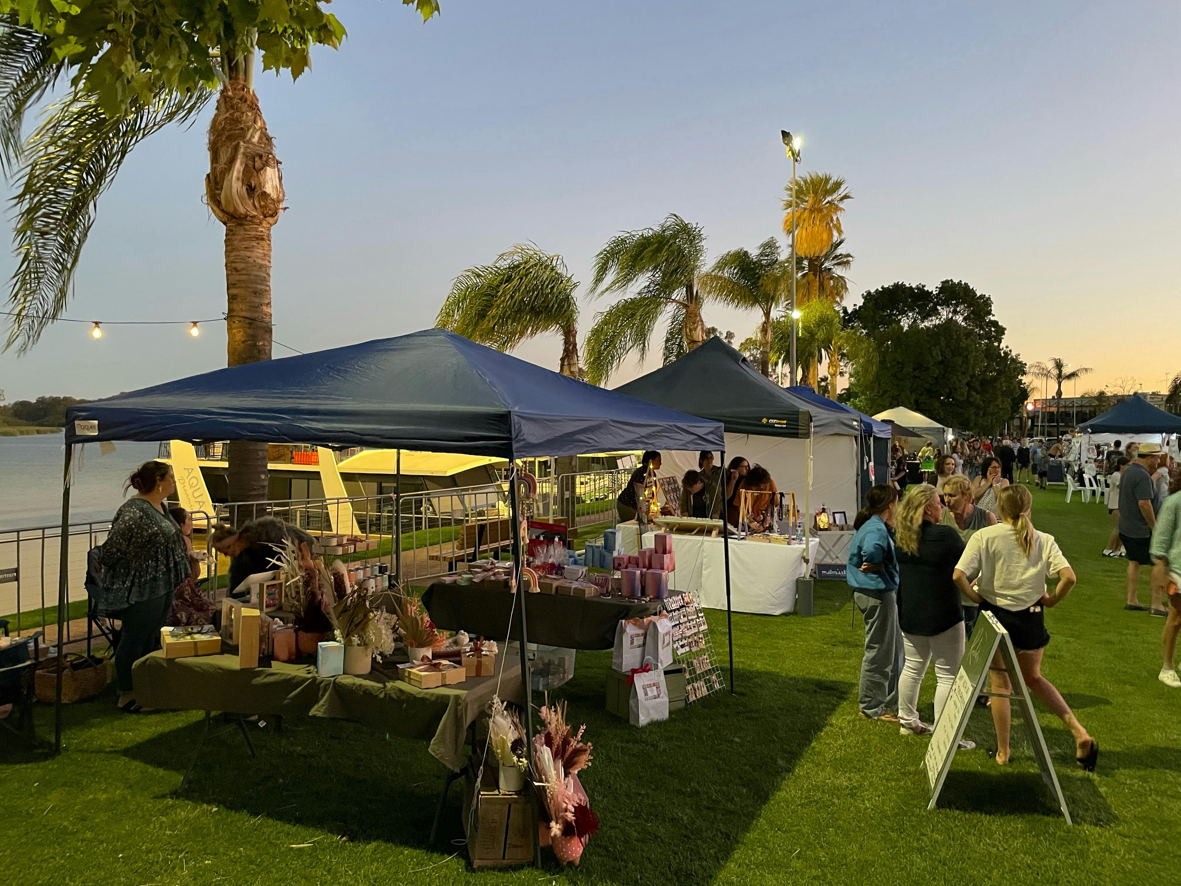 Market stallholders at twilight