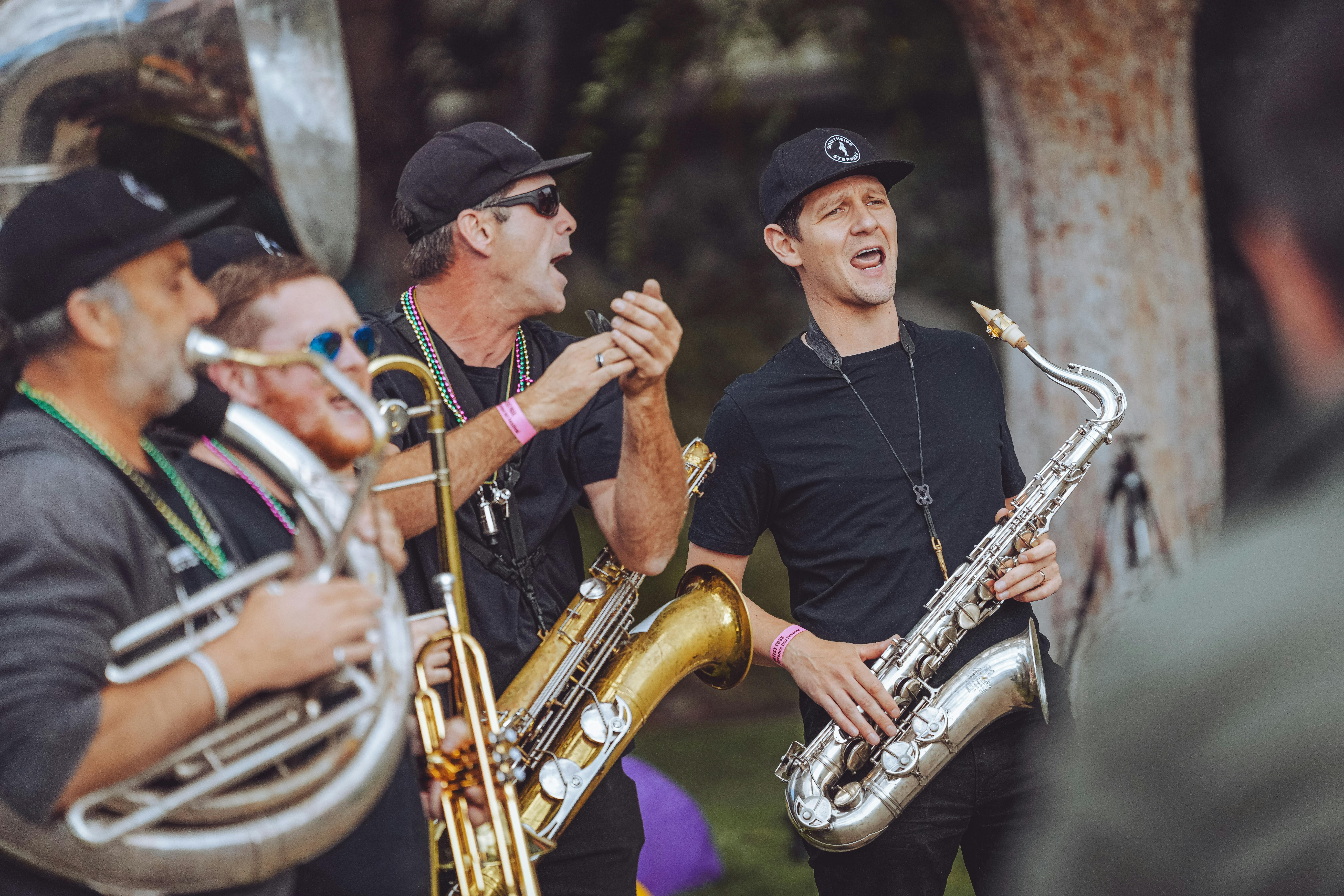 A New Orleans parade-style band playing outside at the 2025 Festival.