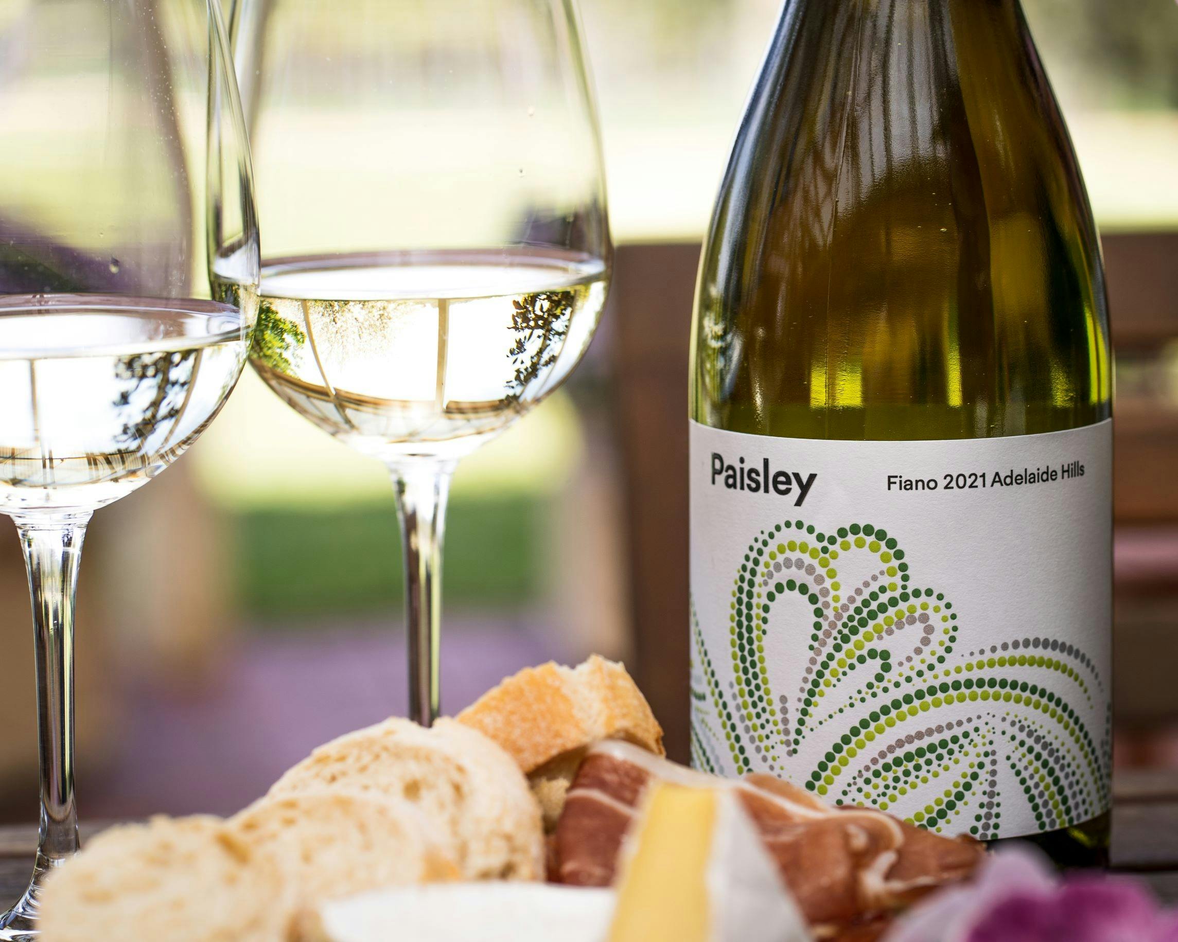 Bottle of Paisley Fiano with wine glasses
