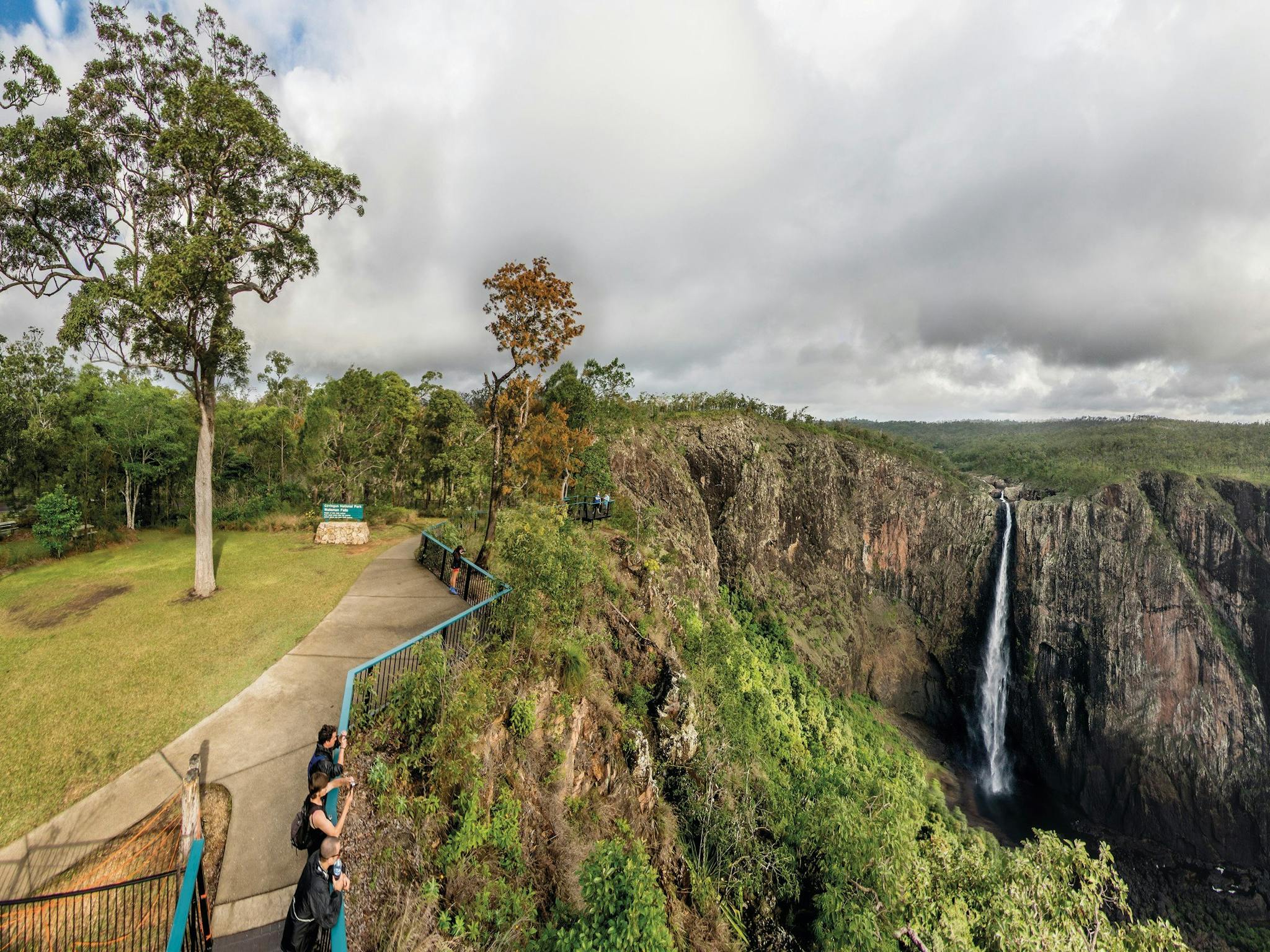 People at lookout with views of waterfall, Wallaman Falls.