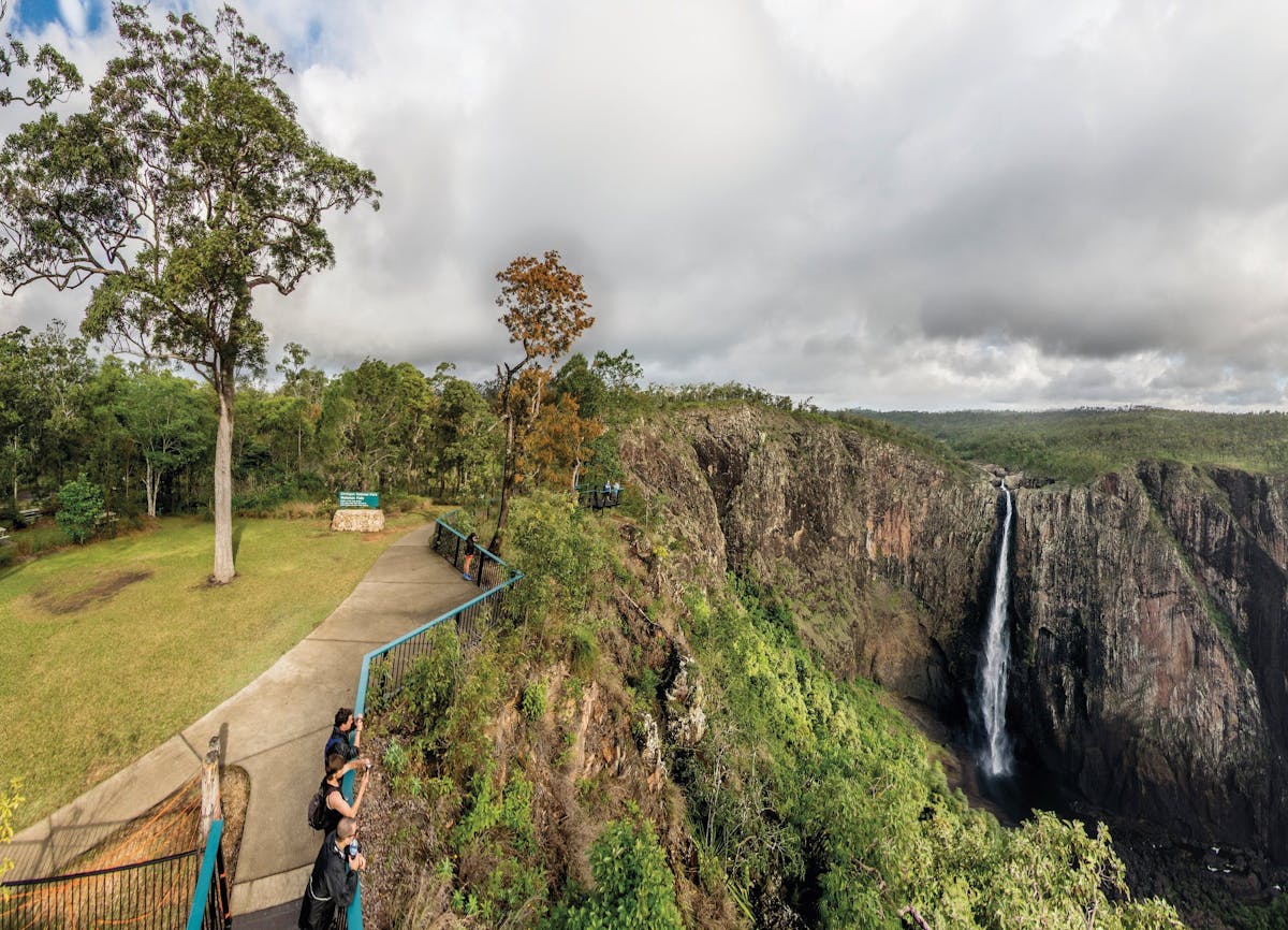 People at lookout with views of waterfall, Wallaman Falls.