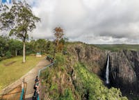 People at lookout with views of waterfall, Wallaman Falls.
