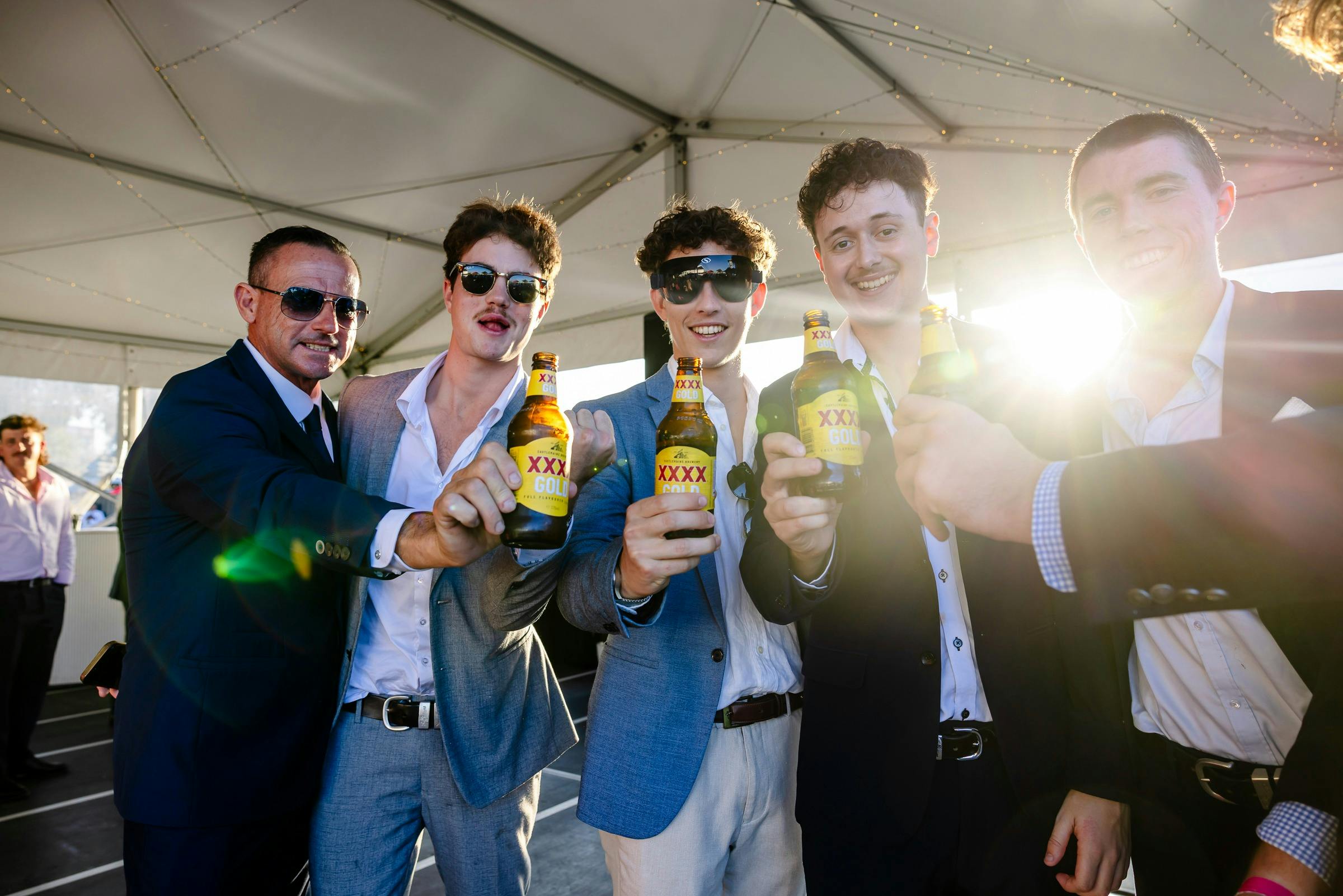 A group of friends cheers their drinks