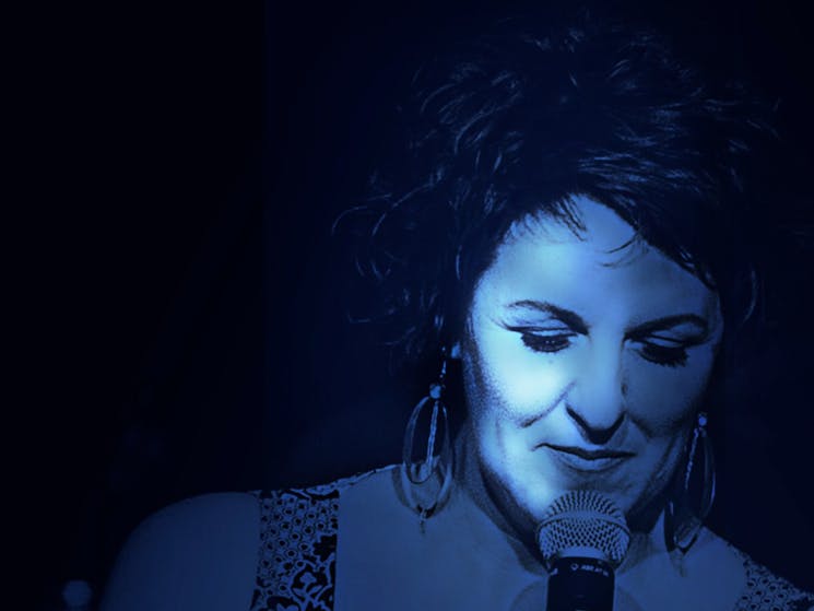 A female singer in blue