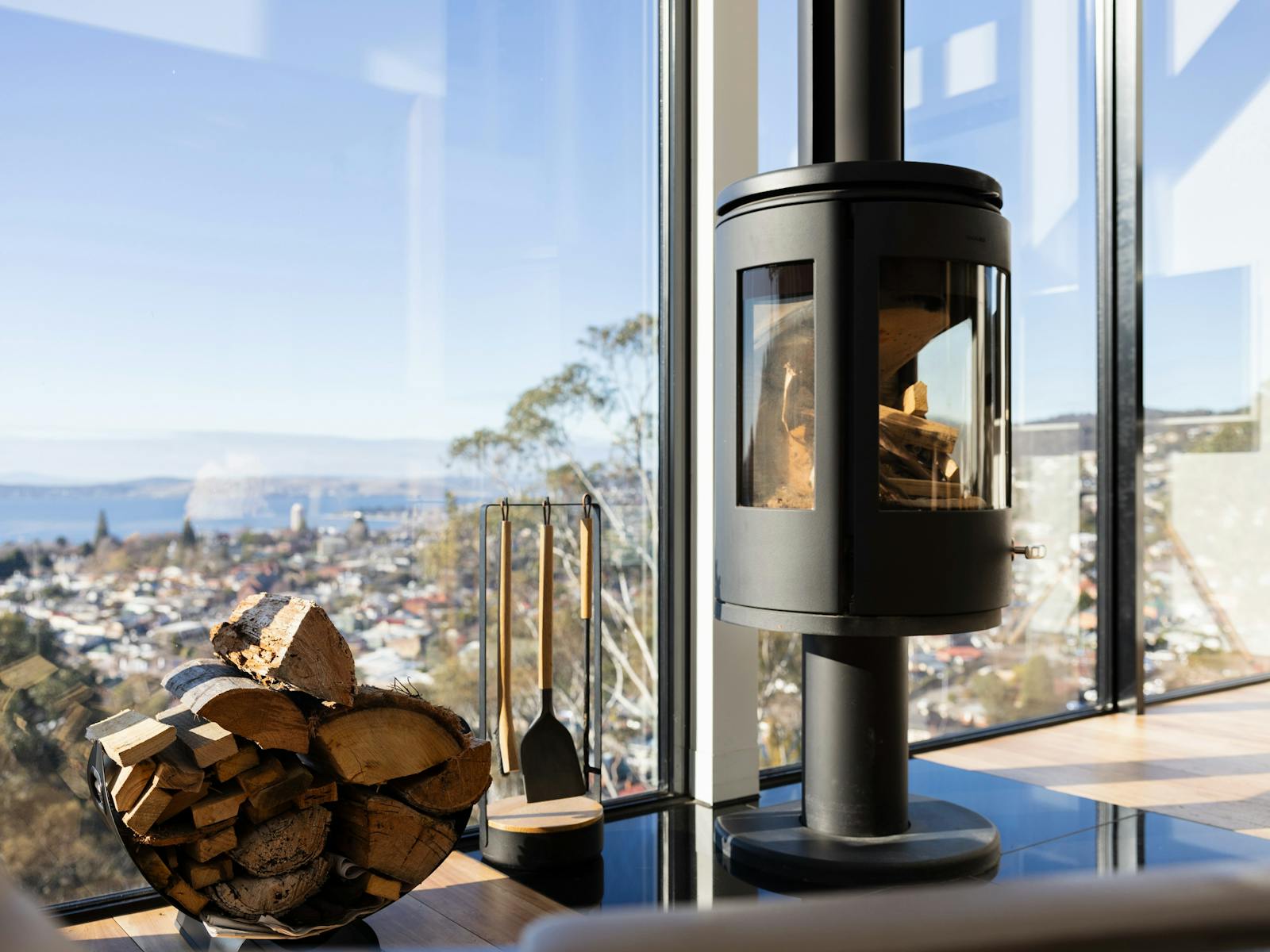 Competing for attention with the ever-changing view beyond is the designer fireplace