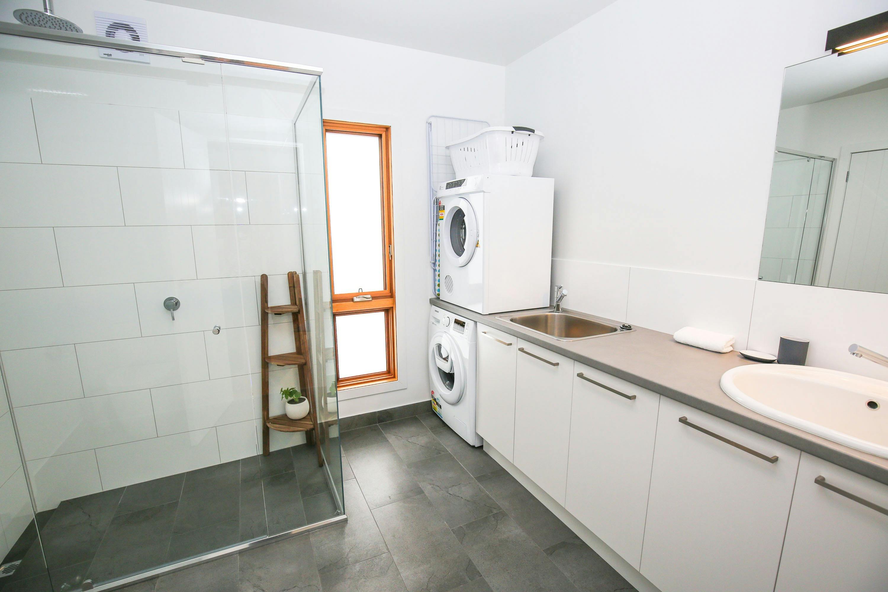 Bathroom and laundry at The Stelvio Villas Two Bright Accommodation Alpine Valley Getaways