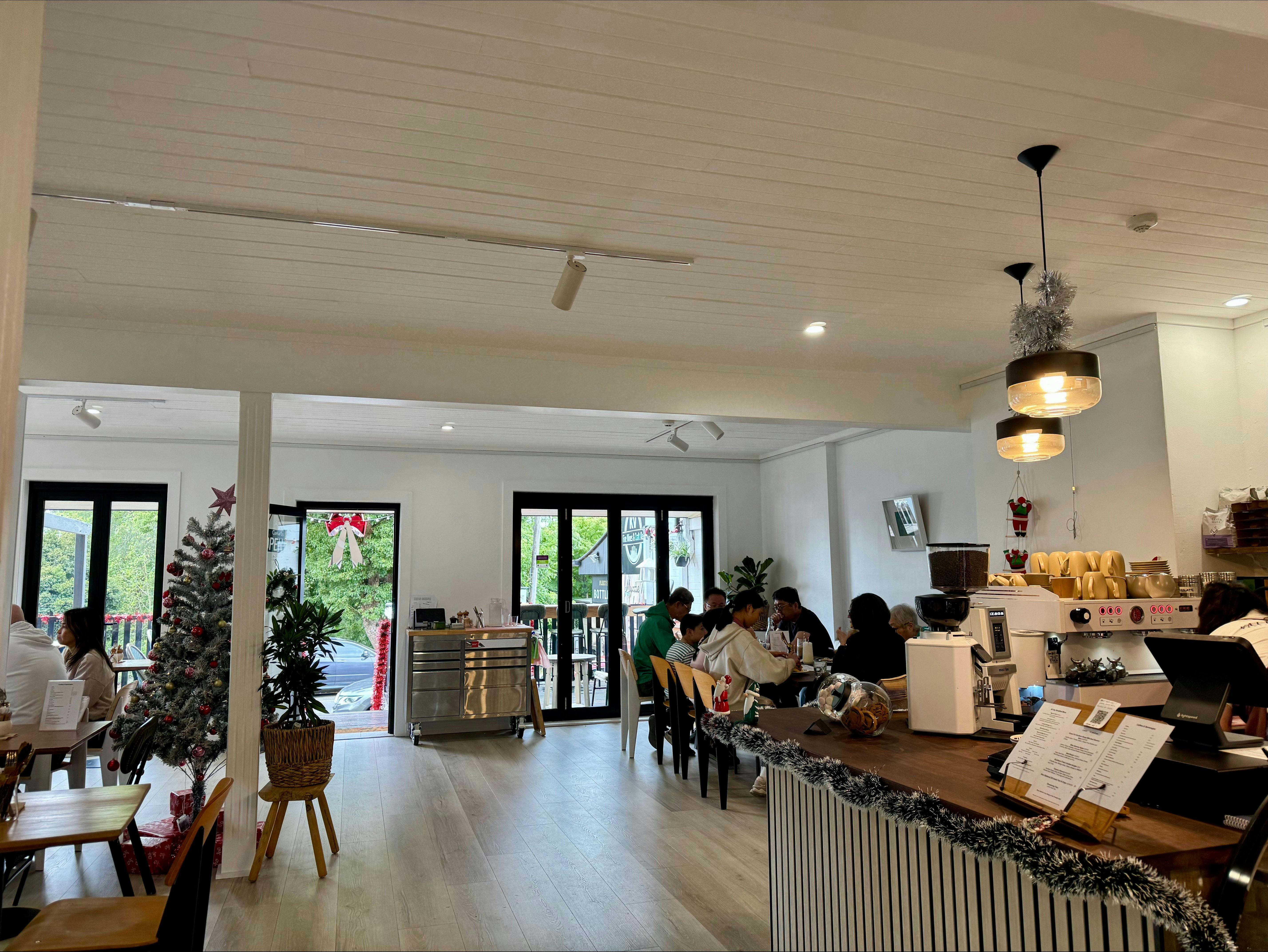Bright Cafe seating area with natural light at Valley Bliss Eatery