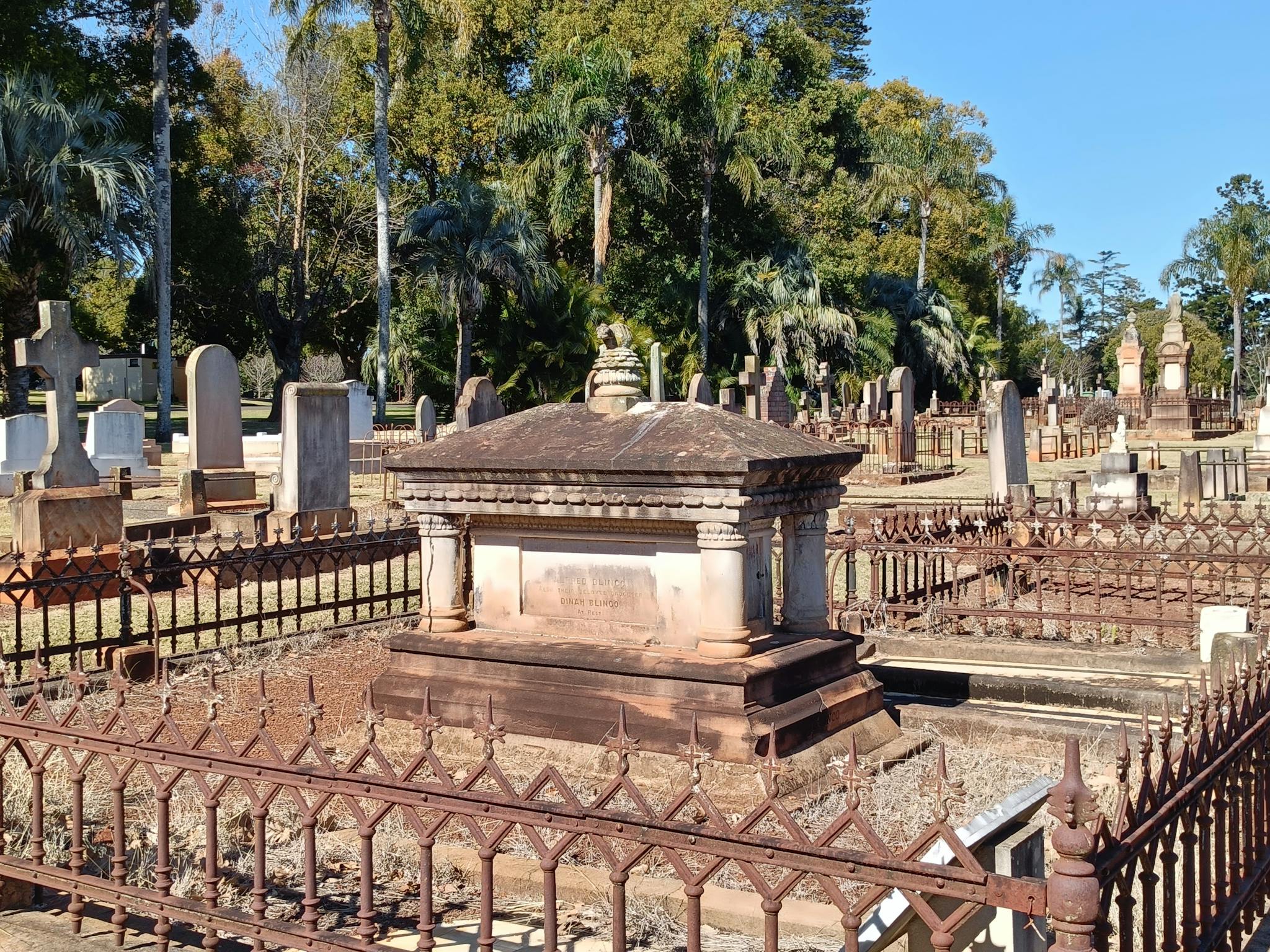 A grave with a tomb monument