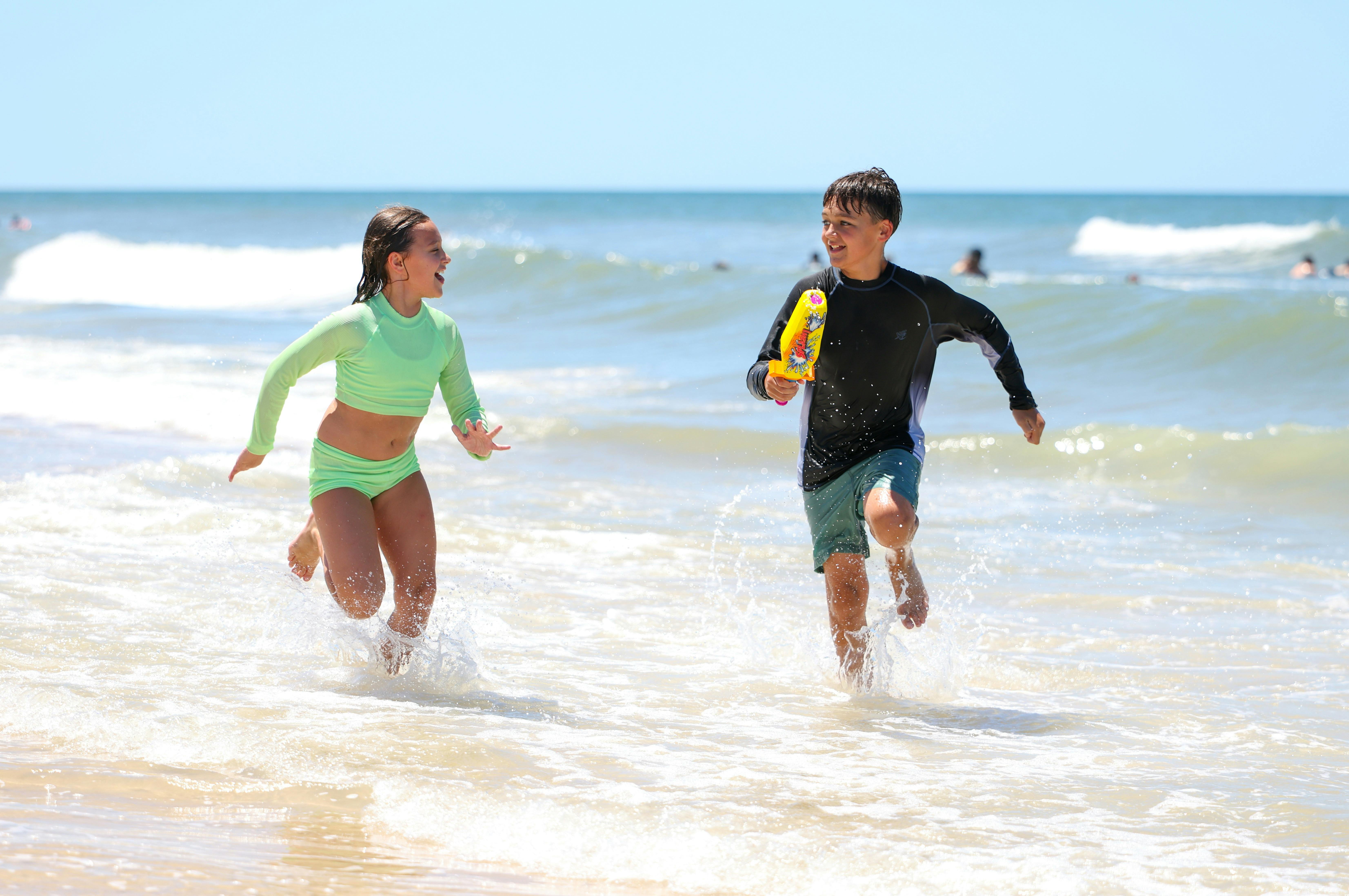 Bribie Island Kids running in sea