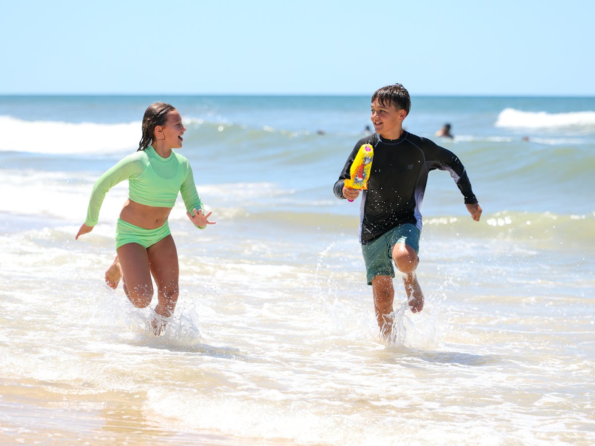 Bribie Island Kids running in sea Bribie Island Kids running in sea