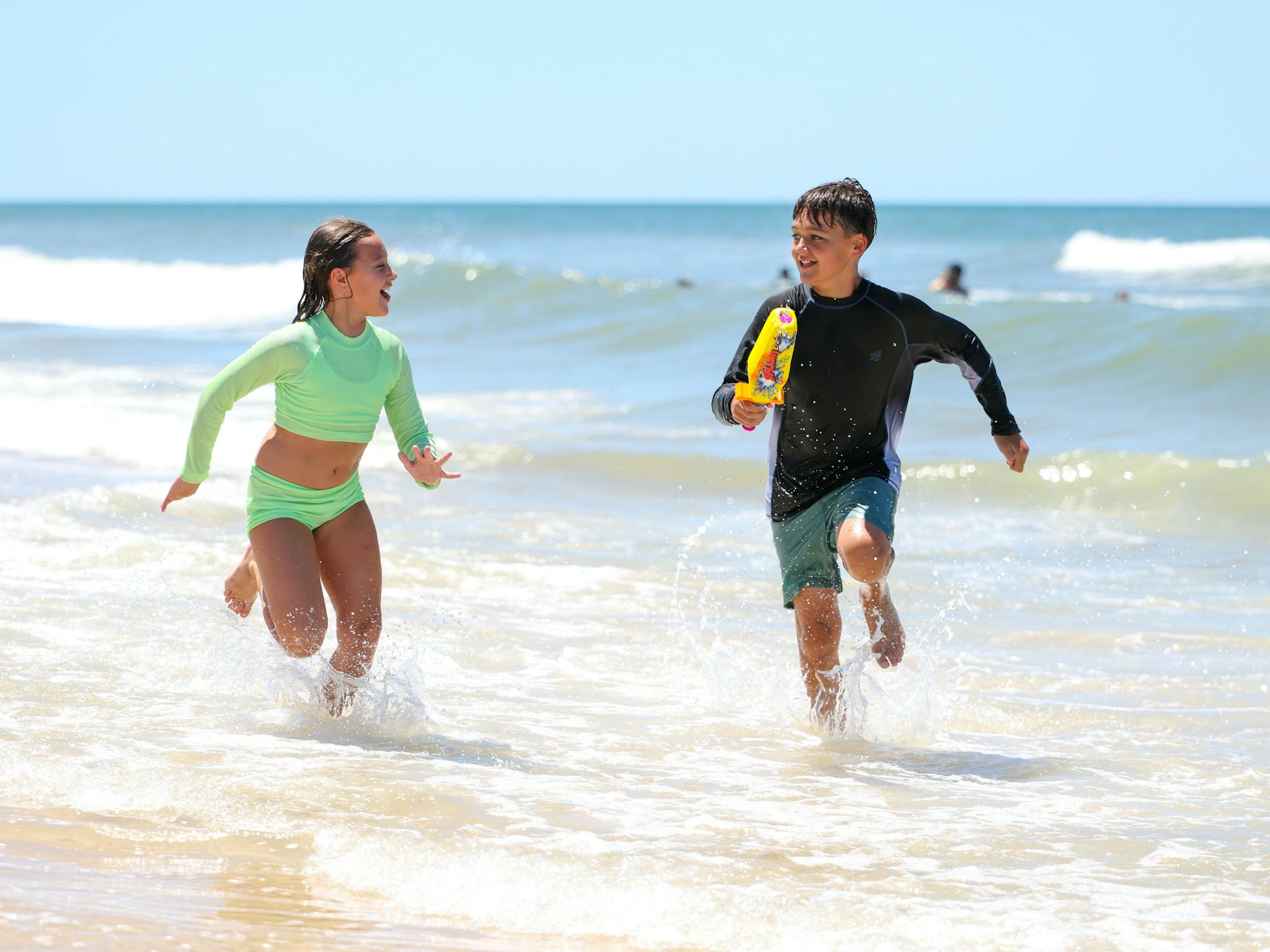Bribie Island Kids running in sea