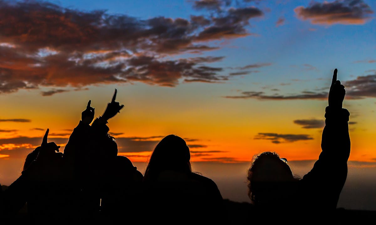 tour group pointing at a satellite