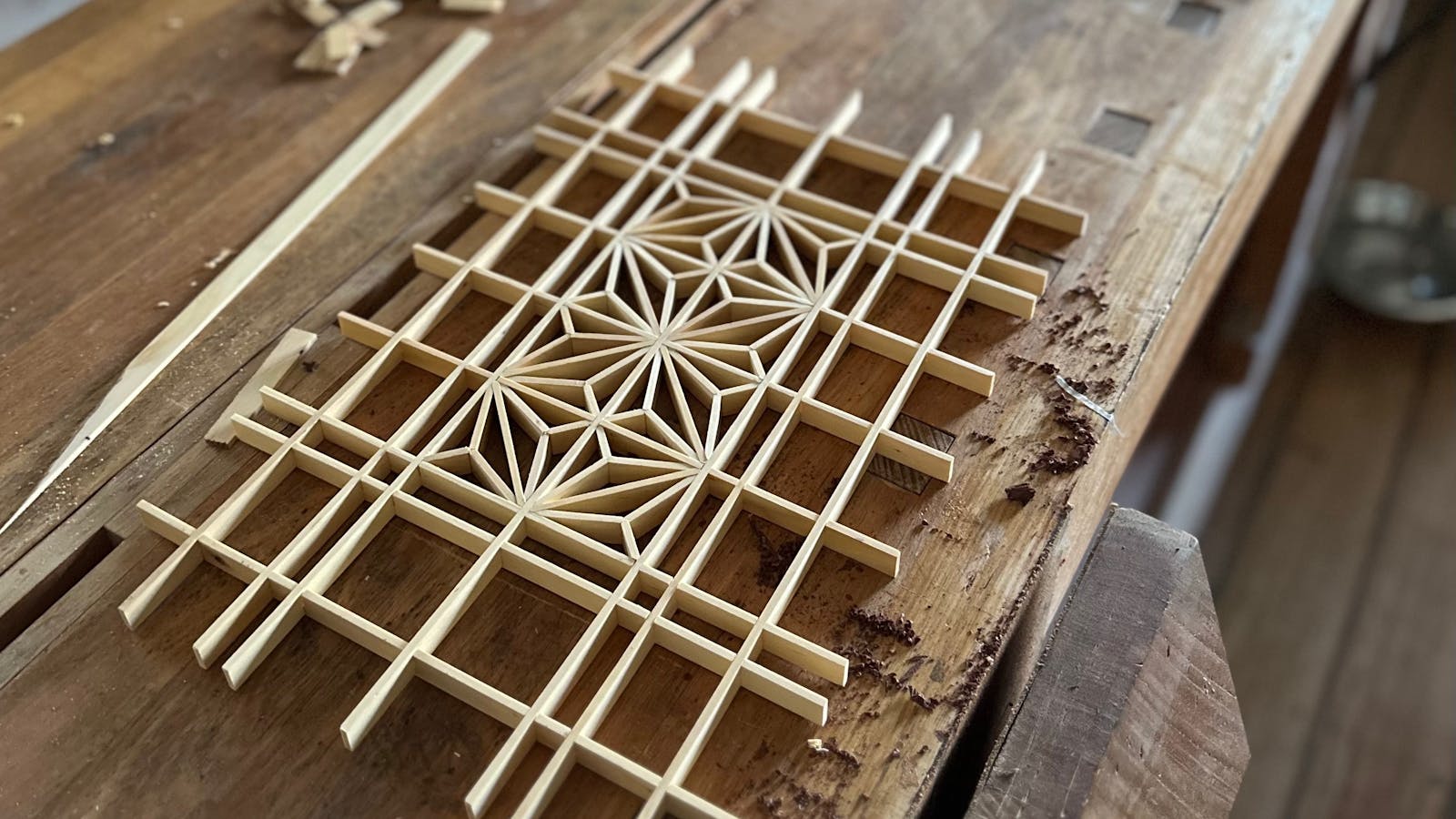 Hand-cut kumiko panel in Huon Pine