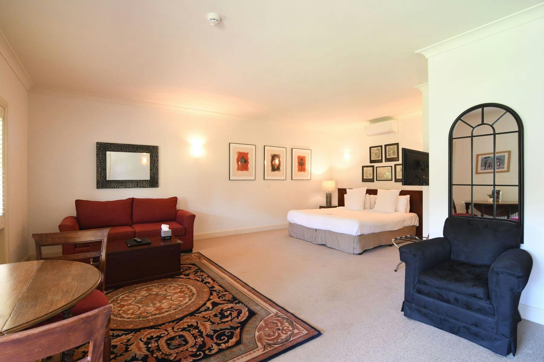 Suite 8, large king bed, double sofa, ensuite. Overlooks the marquee lawn