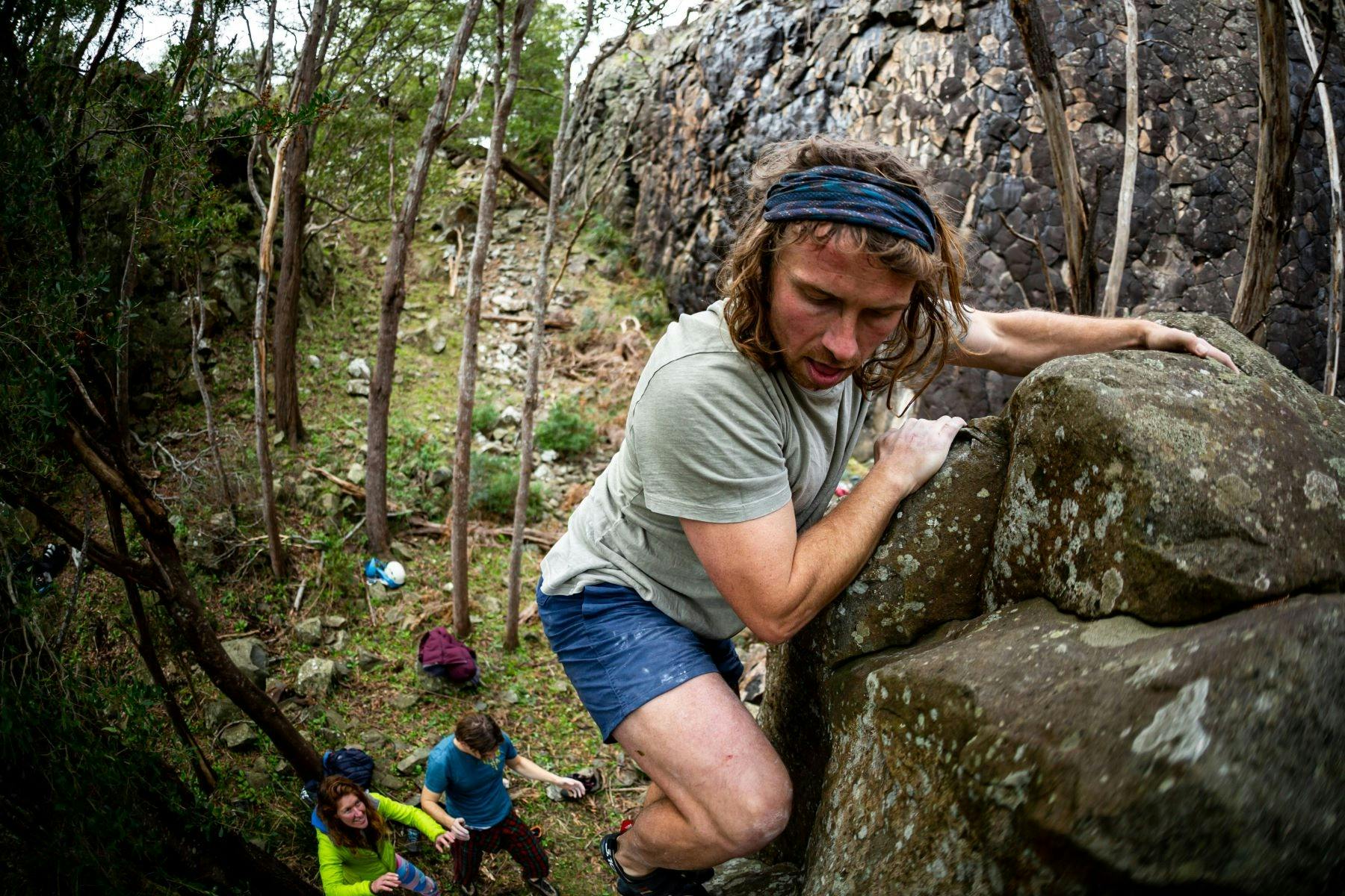 A climber bouldering at Hillwood Rock Climbing facilities