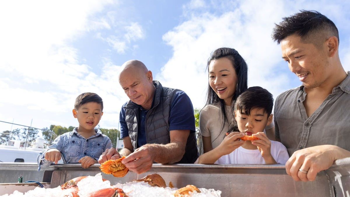 guests looking at seafood on ice