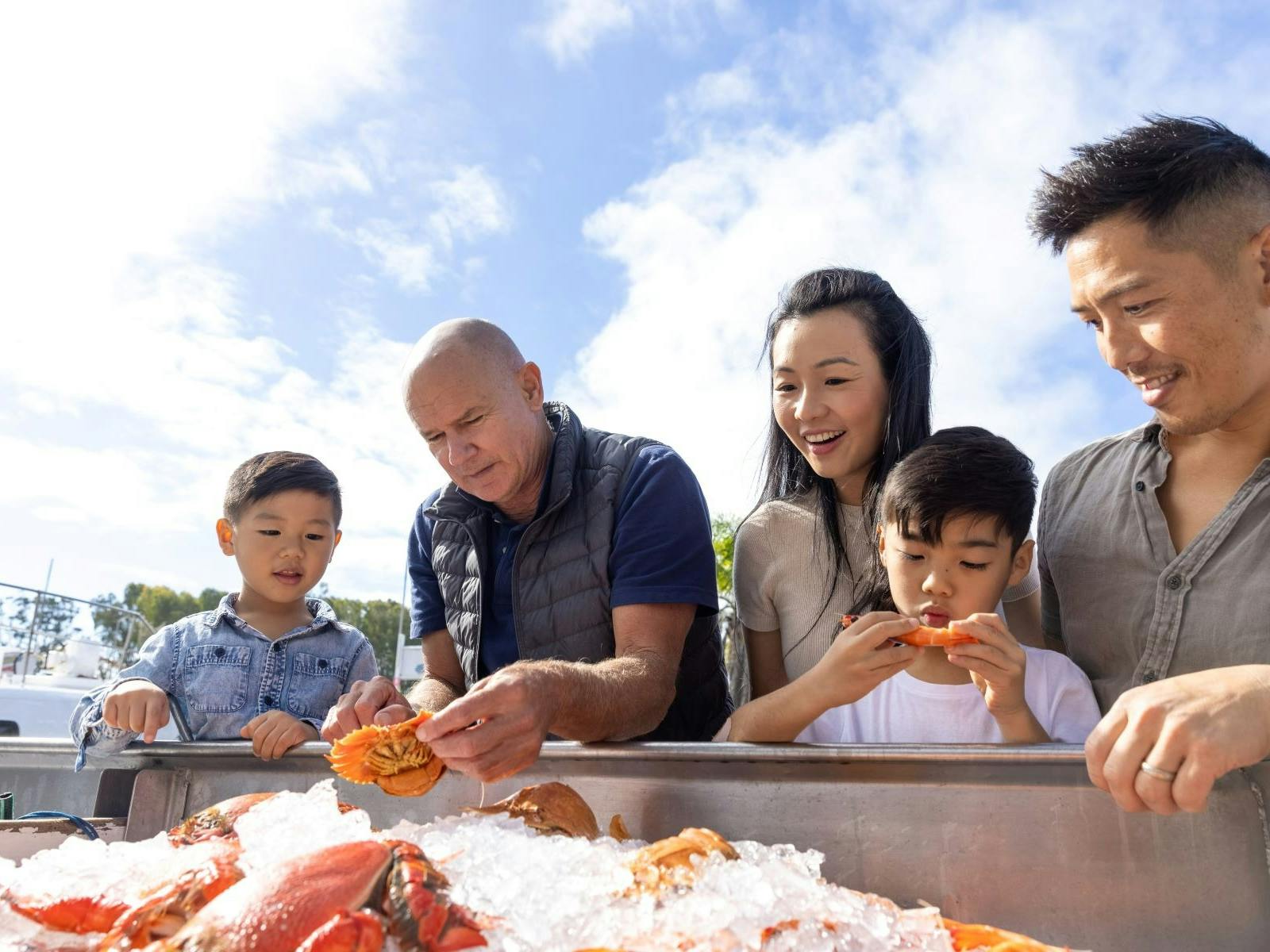guests looking at seafood on ice guests looking at seafood on ice
