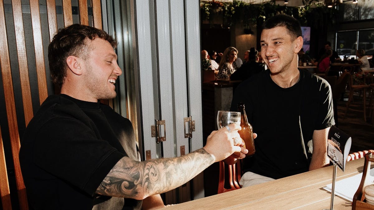 Two men cheers
