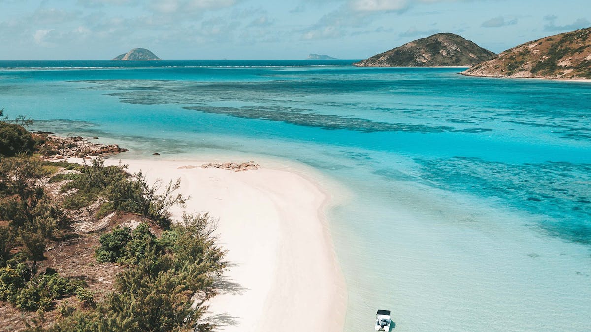 Take your own motorised dinghy to Casuarina Beach and explore the Blue Lagoon