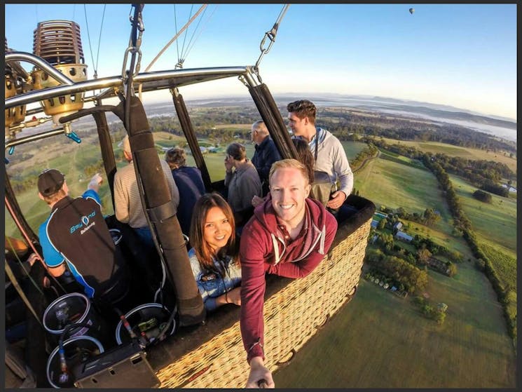 Passengers in hot air balloon