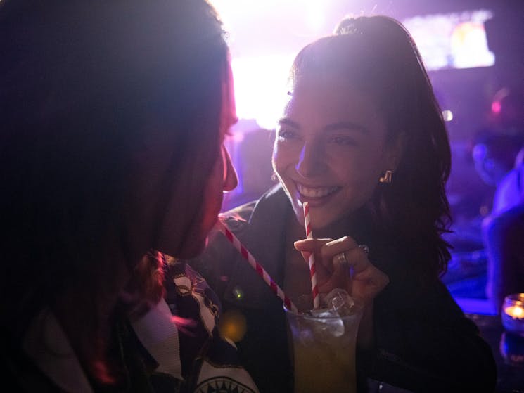 Friends enjoying drinks at Universal Sydney nightclub in Darlinghurst, Sydney